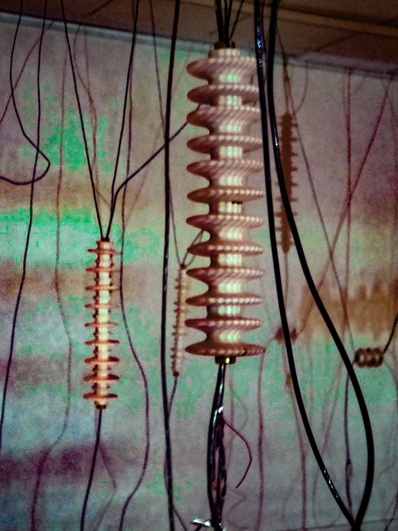 White Noise Porcelain, gold luster, wire, electronic parts, video projection., 2010