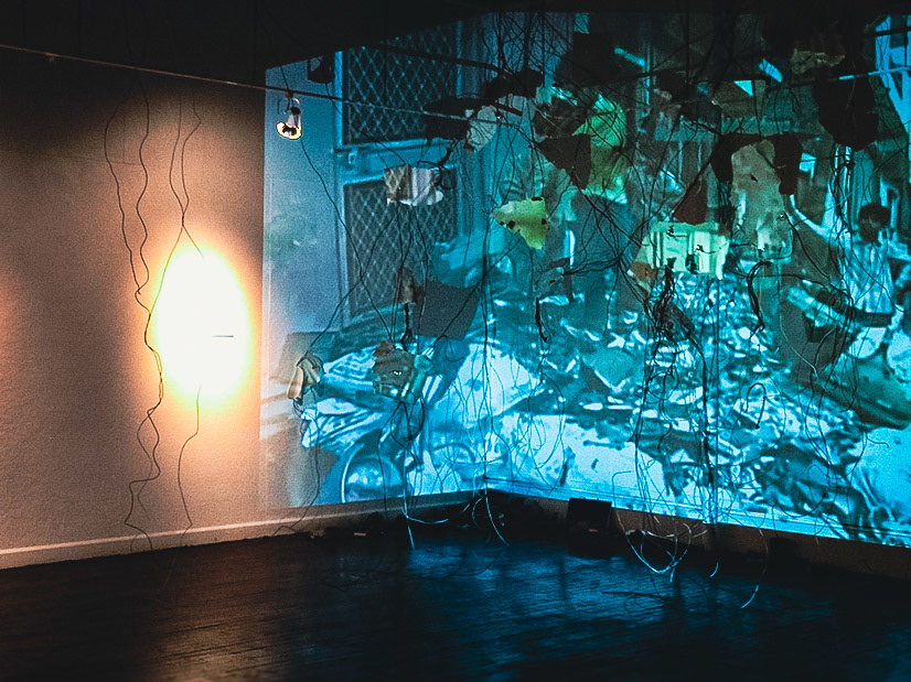 Diffusion  Porcelain, gold luster, gold leaf, found computer components, wire, video projection., 2011