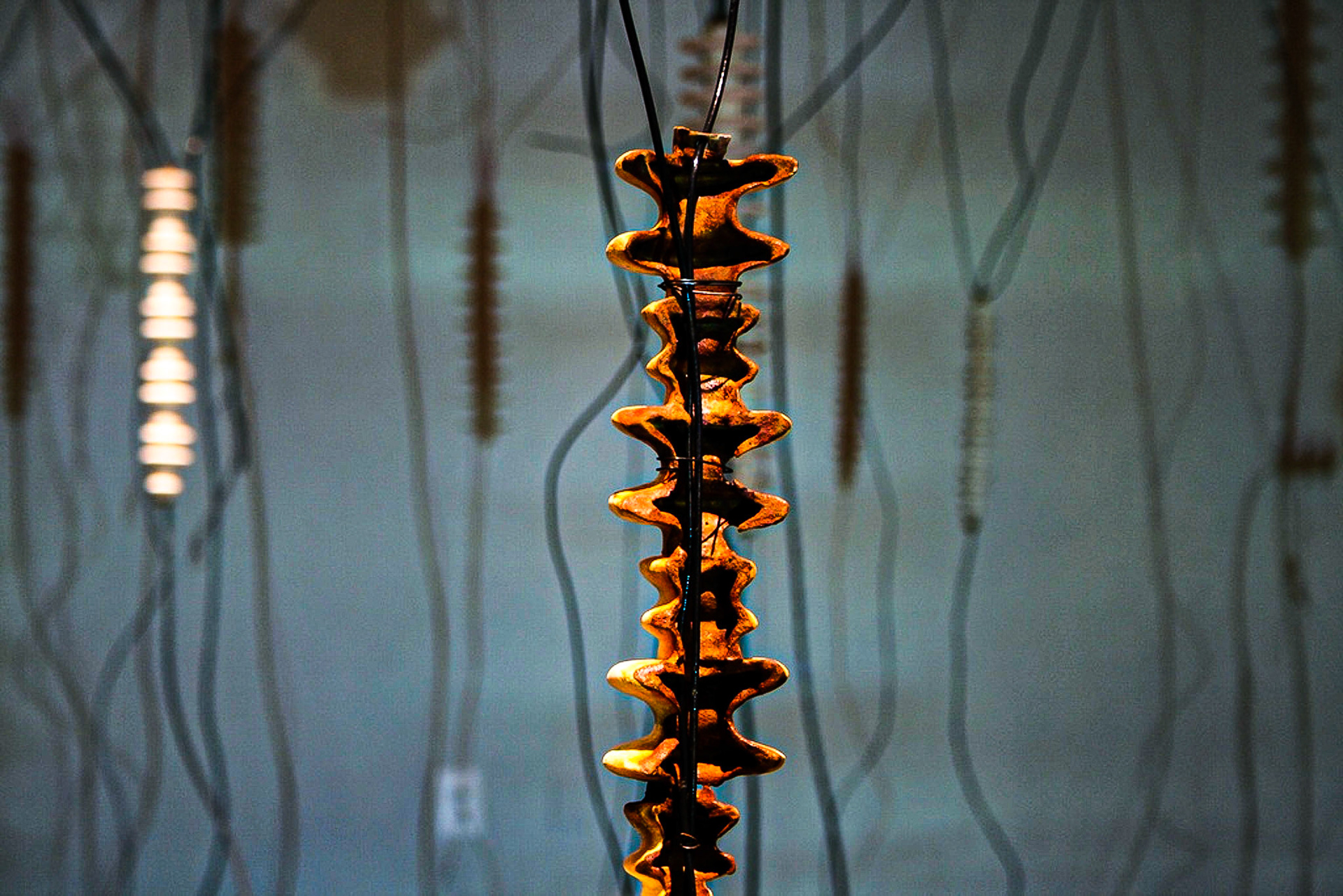 White Noise Porcelain, gold luster, wire, electronic parts, video projection., 2010