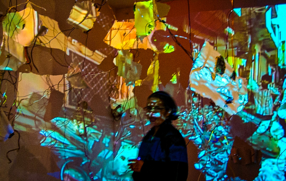 Diffusion  Porcelain, gold luster, gold leaf, found computer components, wire, video projection., 2011