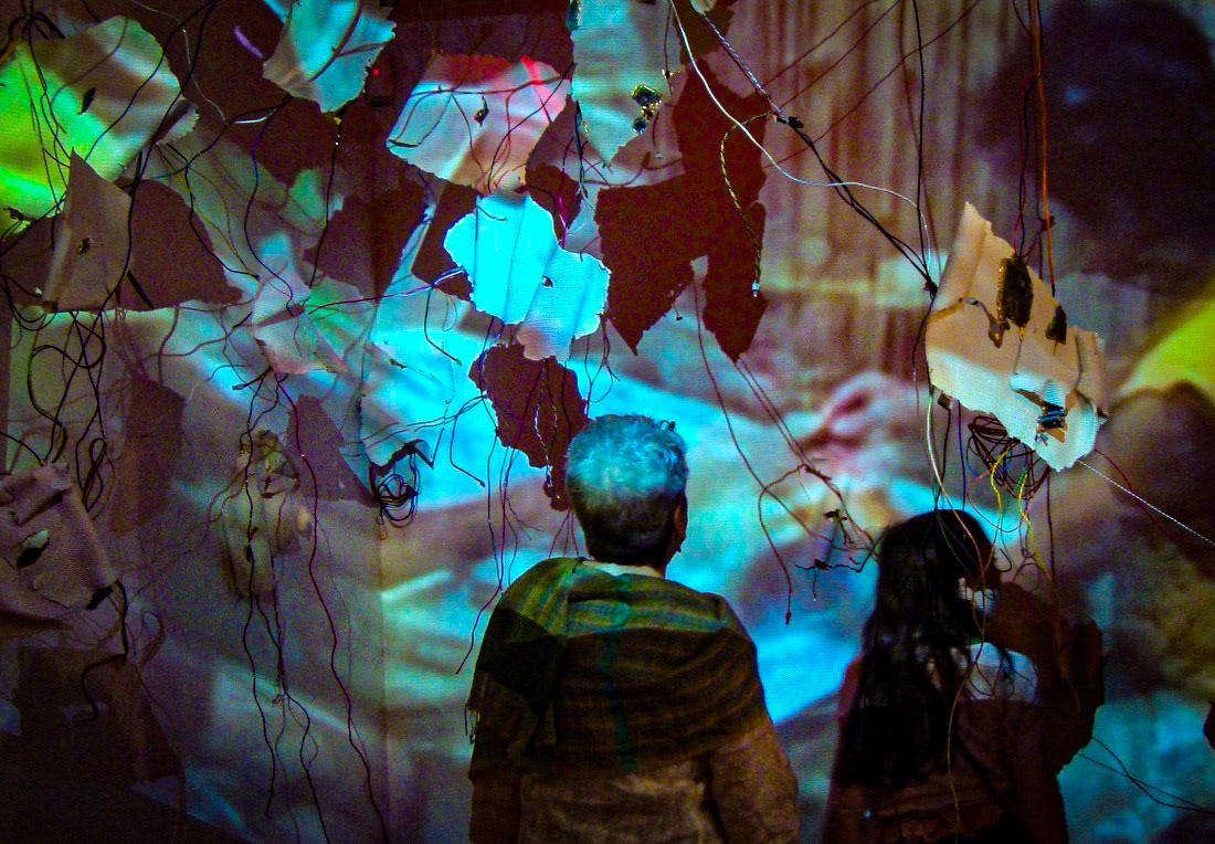 Diffusion  Porcelain, gold luster, gold leaf, found computer components, wire, video projection., 2011