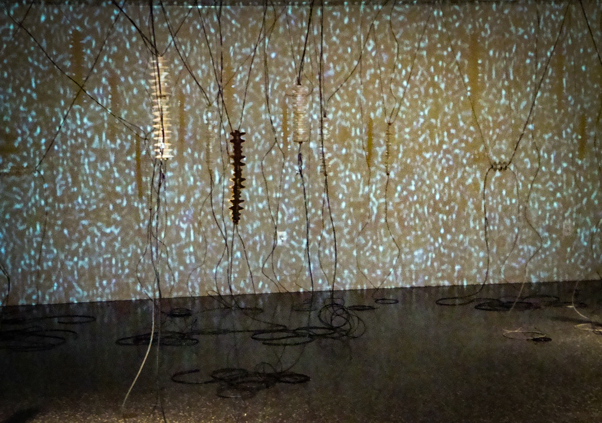 White Noise Porcelain, gold luster, wire, electronic parts, video projection., 2010