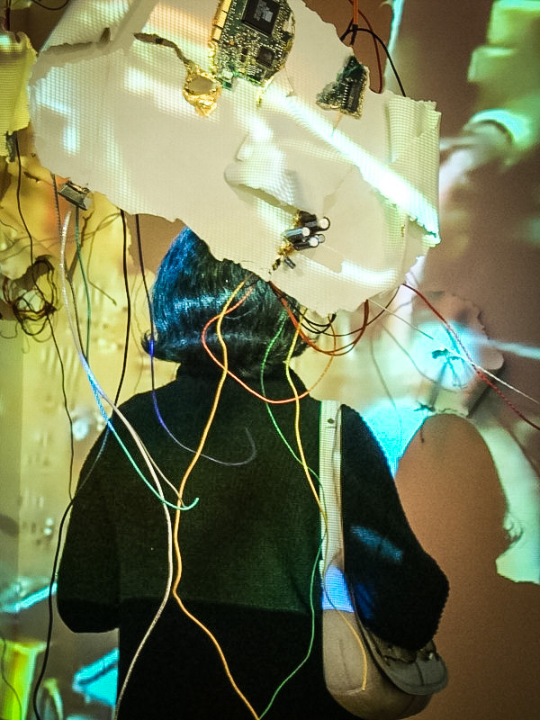 Diffusion  Porcelain, gold luster, gold leaf, found computer components, wire, video projection., 2011