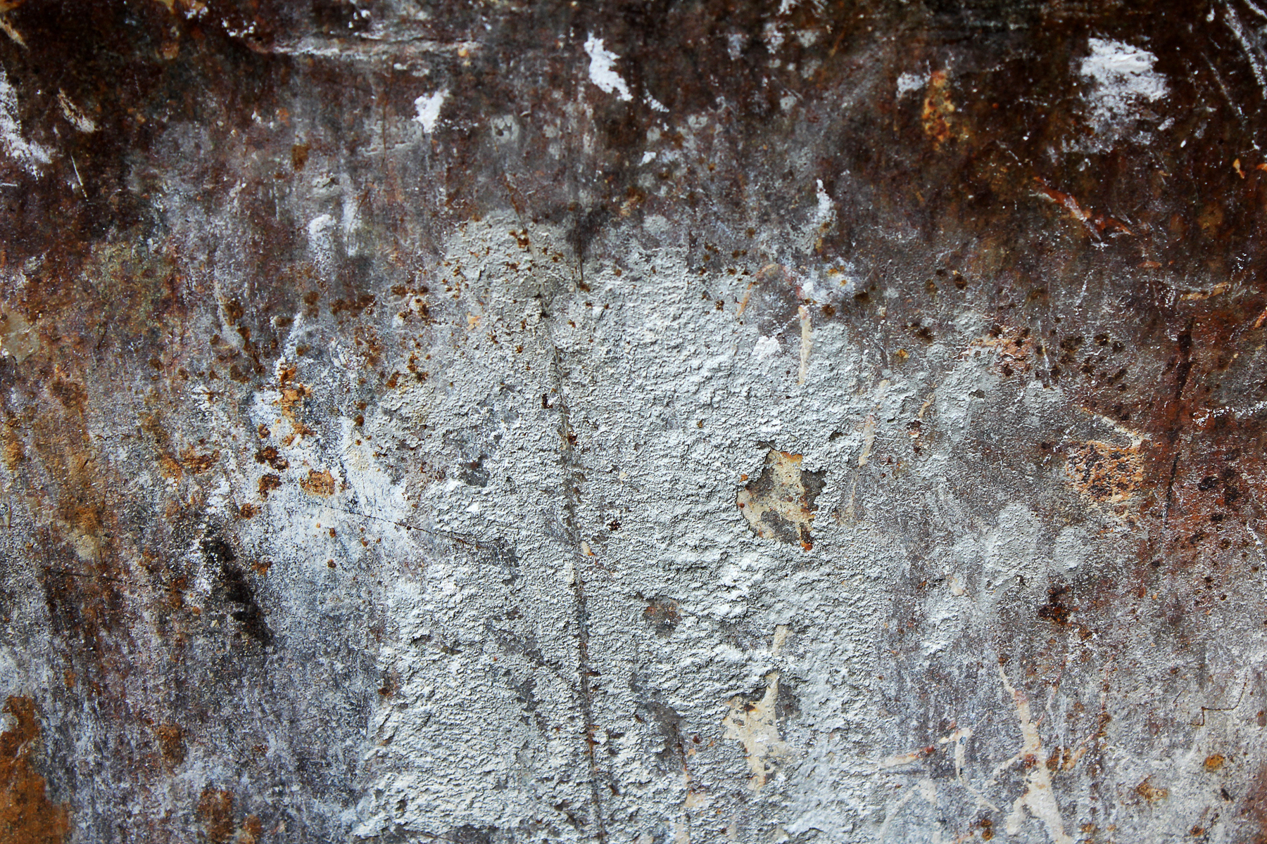 A photo of the interior surface of a dumpster, interpreted as a landscape.