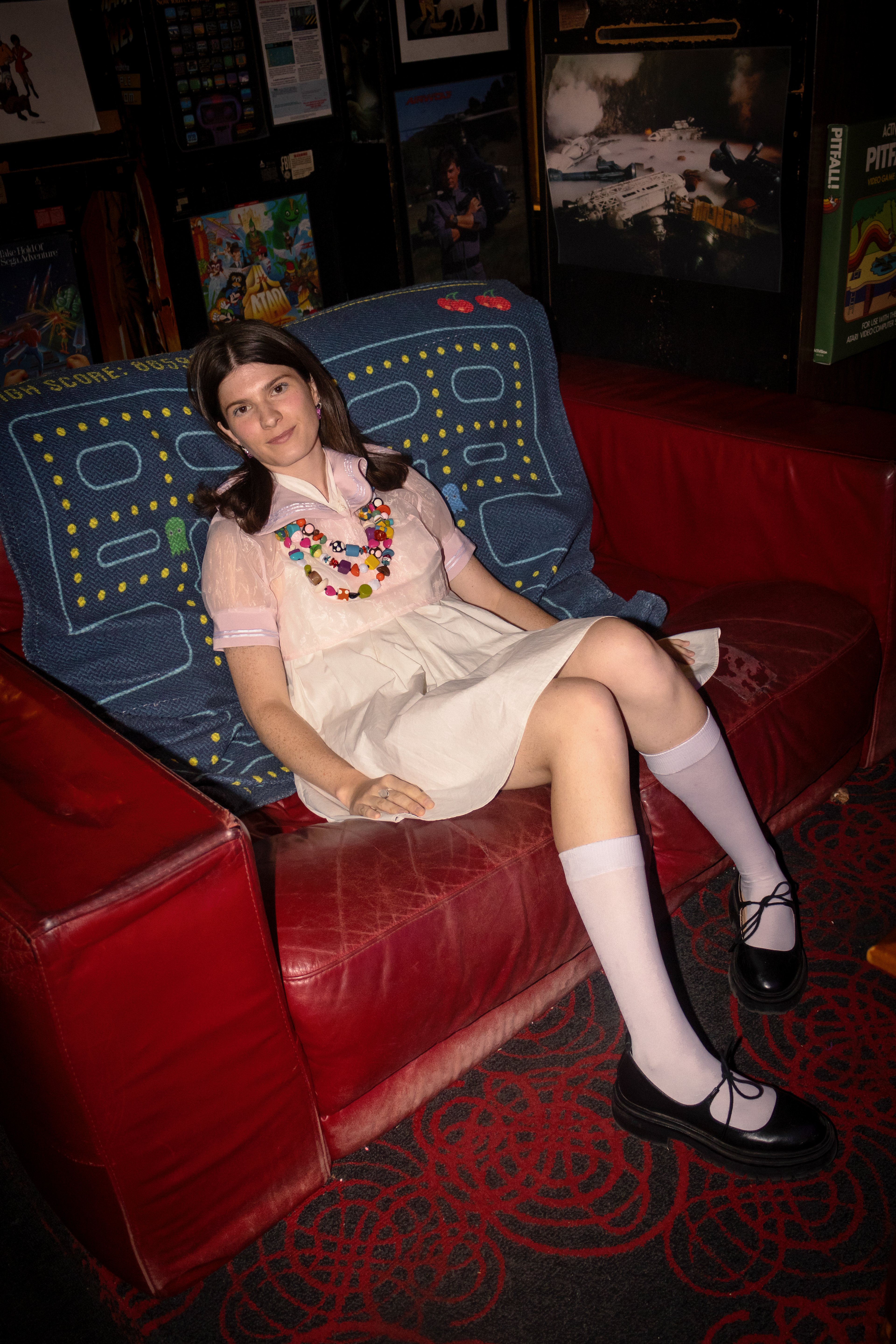 bailee king in a high neck babydoll dress and sheer pink sailor bolero featured at arkadia