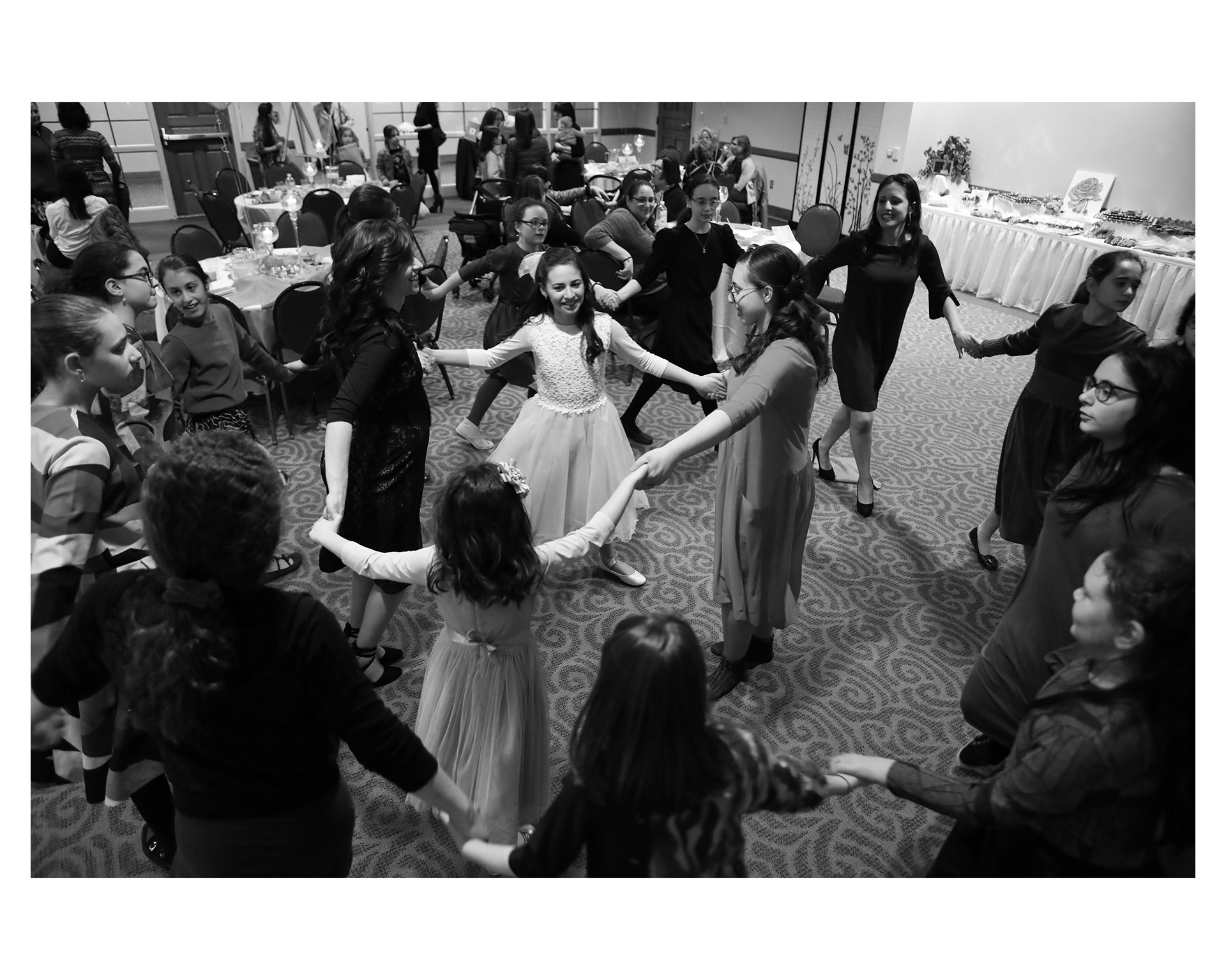 Chani dances with her friends at her bat mitzvah.