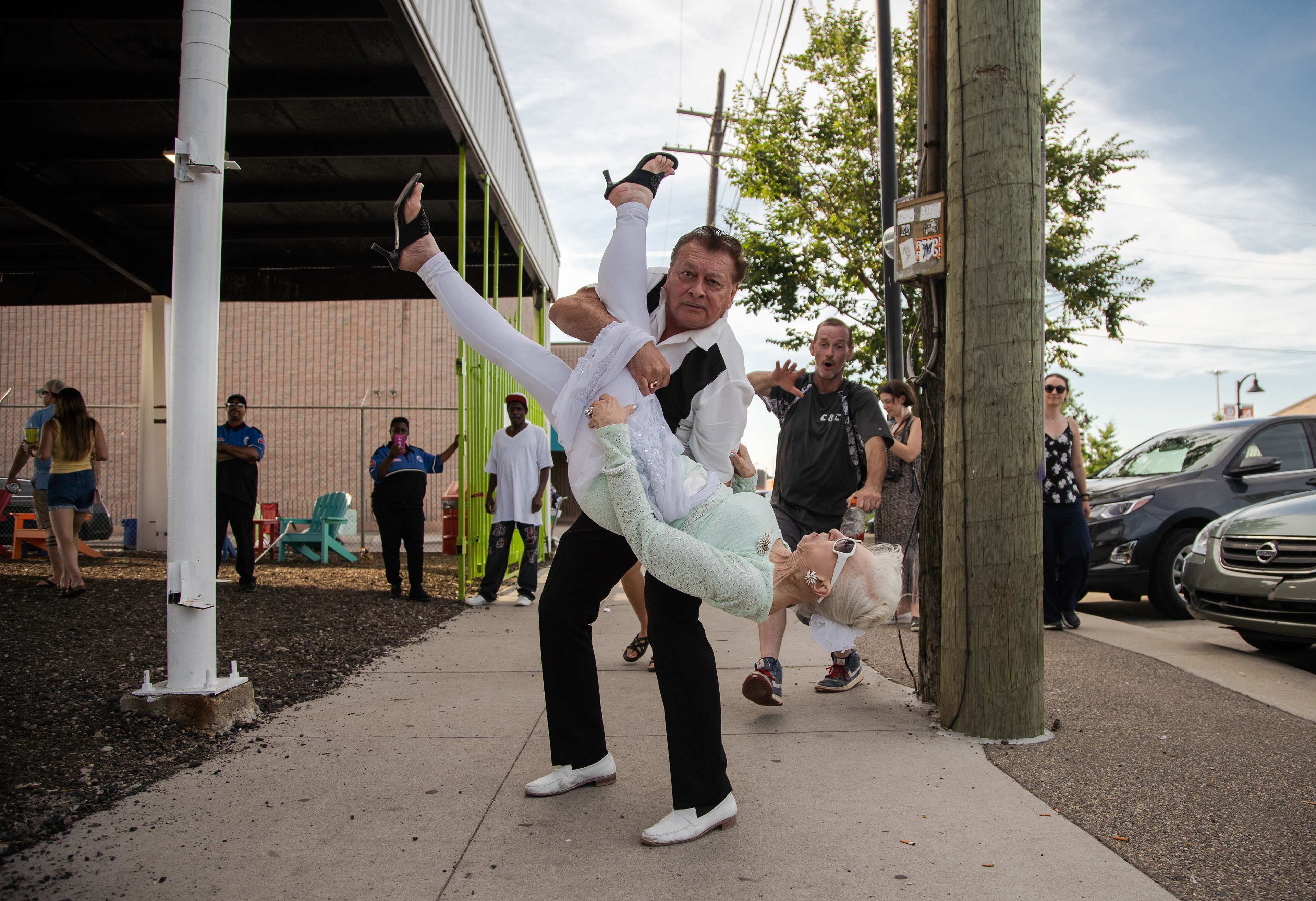 Carlo Dance dips his wife Rosebud Dance, both Detroit residents, during the Art Park grand opening at Eastern Market on July 18, 2019. "We've been married way over 60 years," Carlo Dance said.