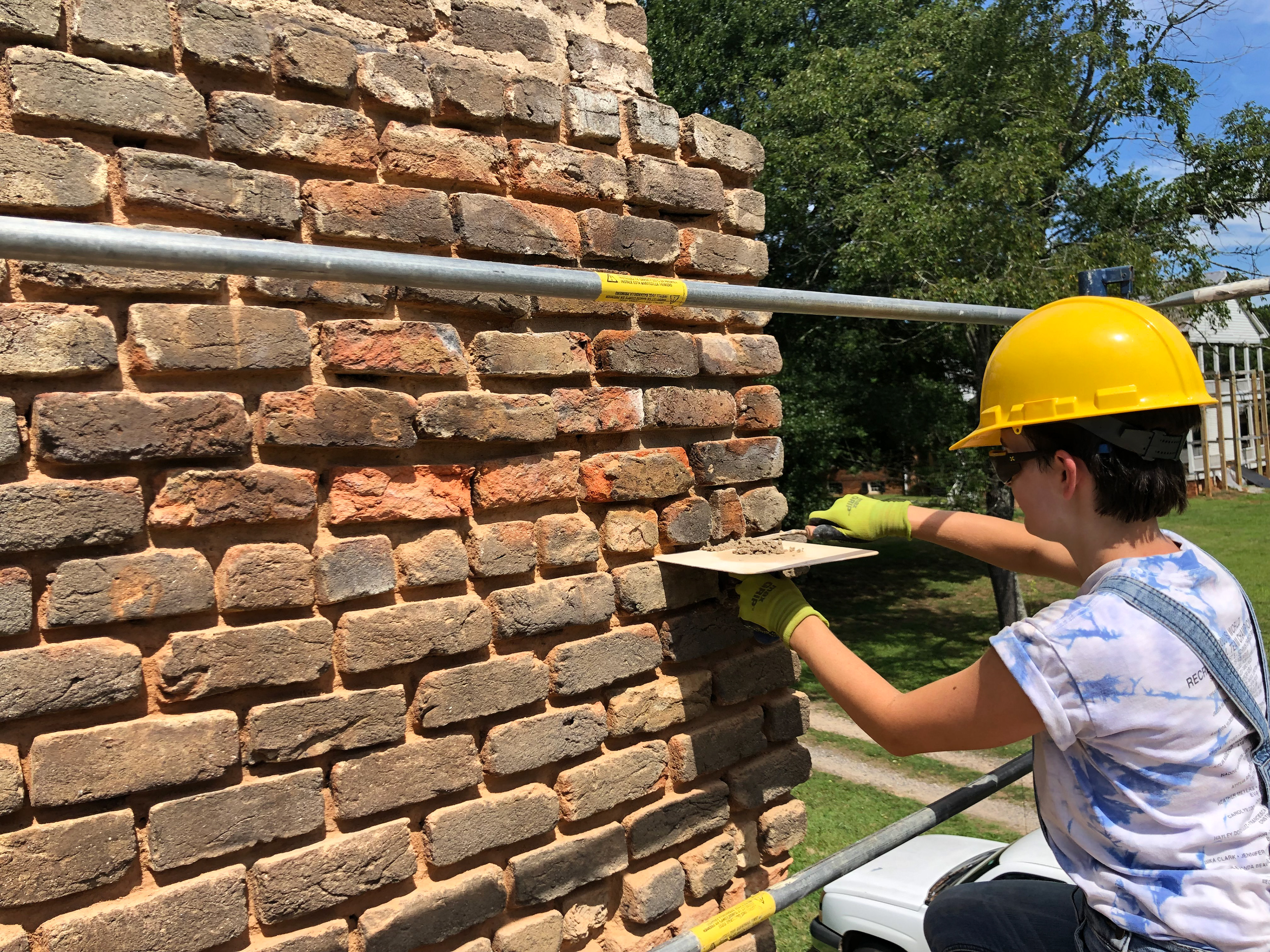 After the bedding mortar was allowed to partially cure, fresh pointing mortar was applied.