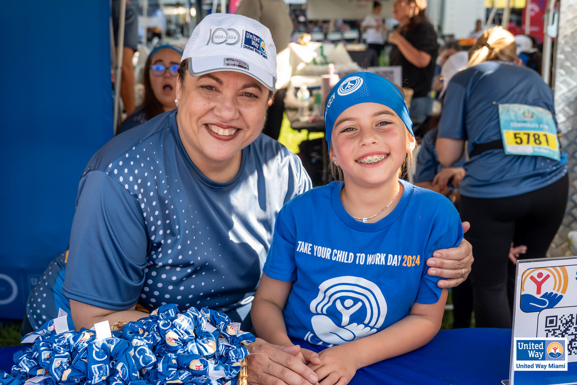 UWM 100 Years scrunchies, cap, Dri-FIT T-Shirt, headband and children's T-Shirt
