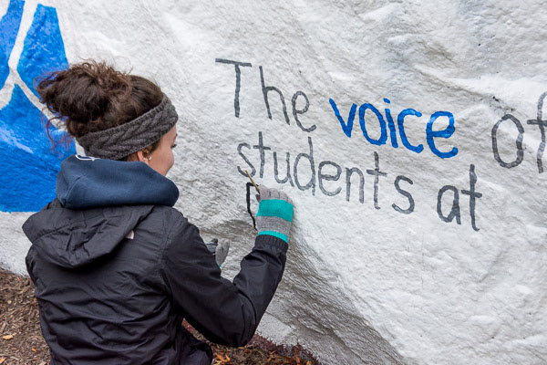Ali painting the "rock" as an advertisement for SGA