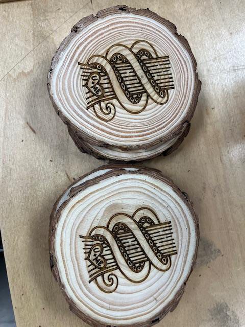 wedding coasters with wedding logo burned into the wood