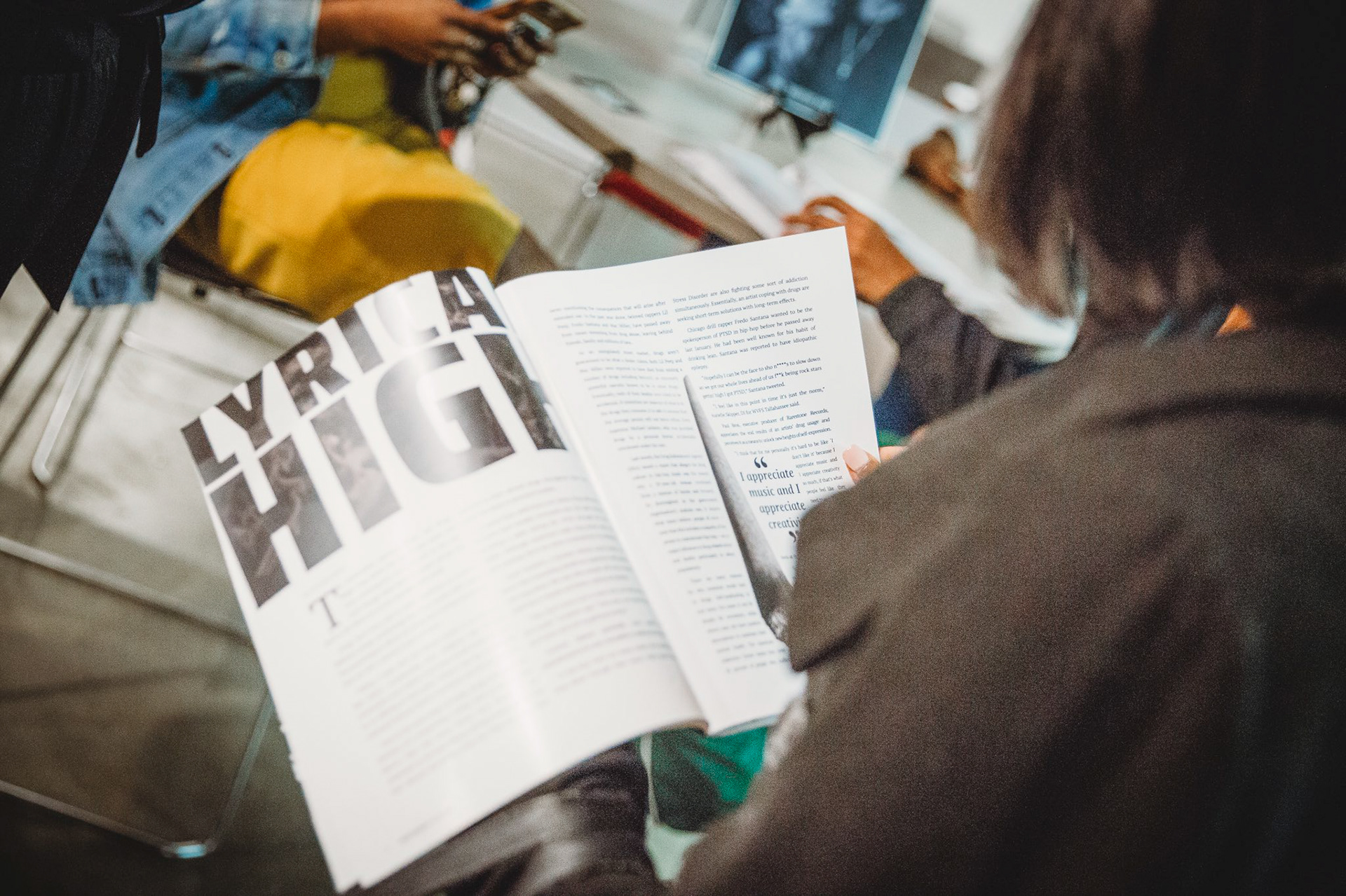 Student reading article in magazine