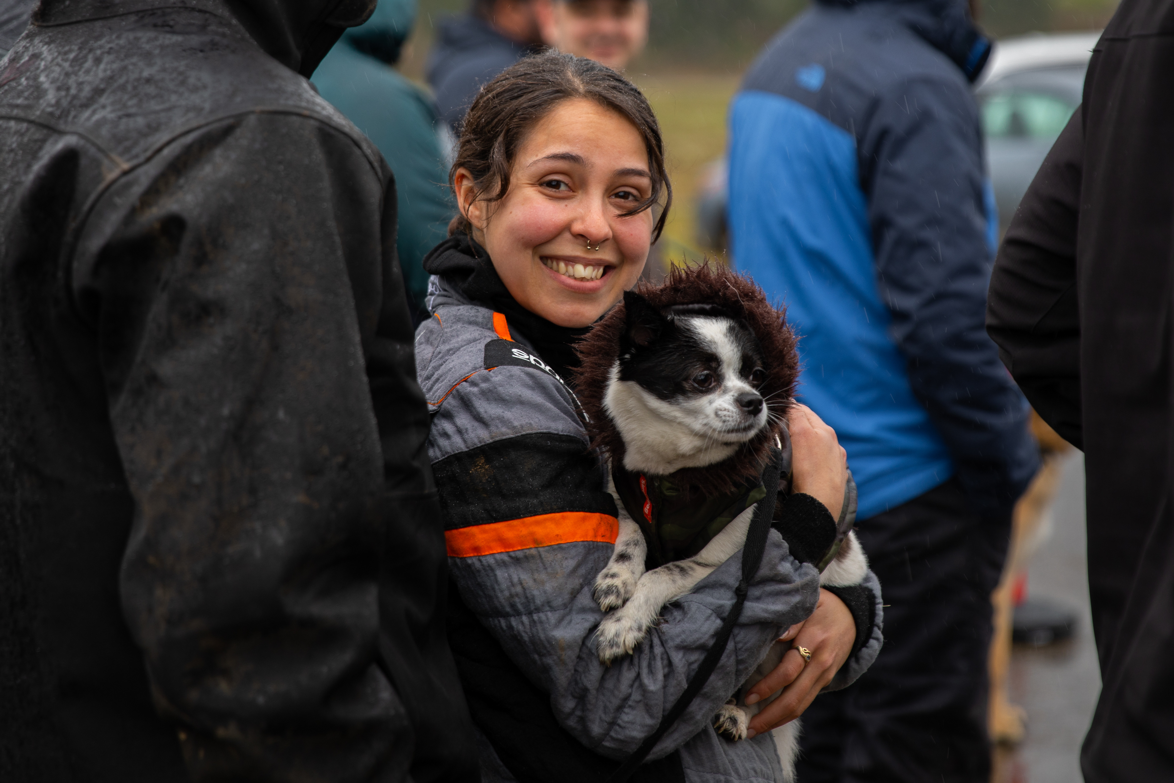 Codriver Andrea Lauria and the crew's best friend, Lucy, before the podium ceremony.