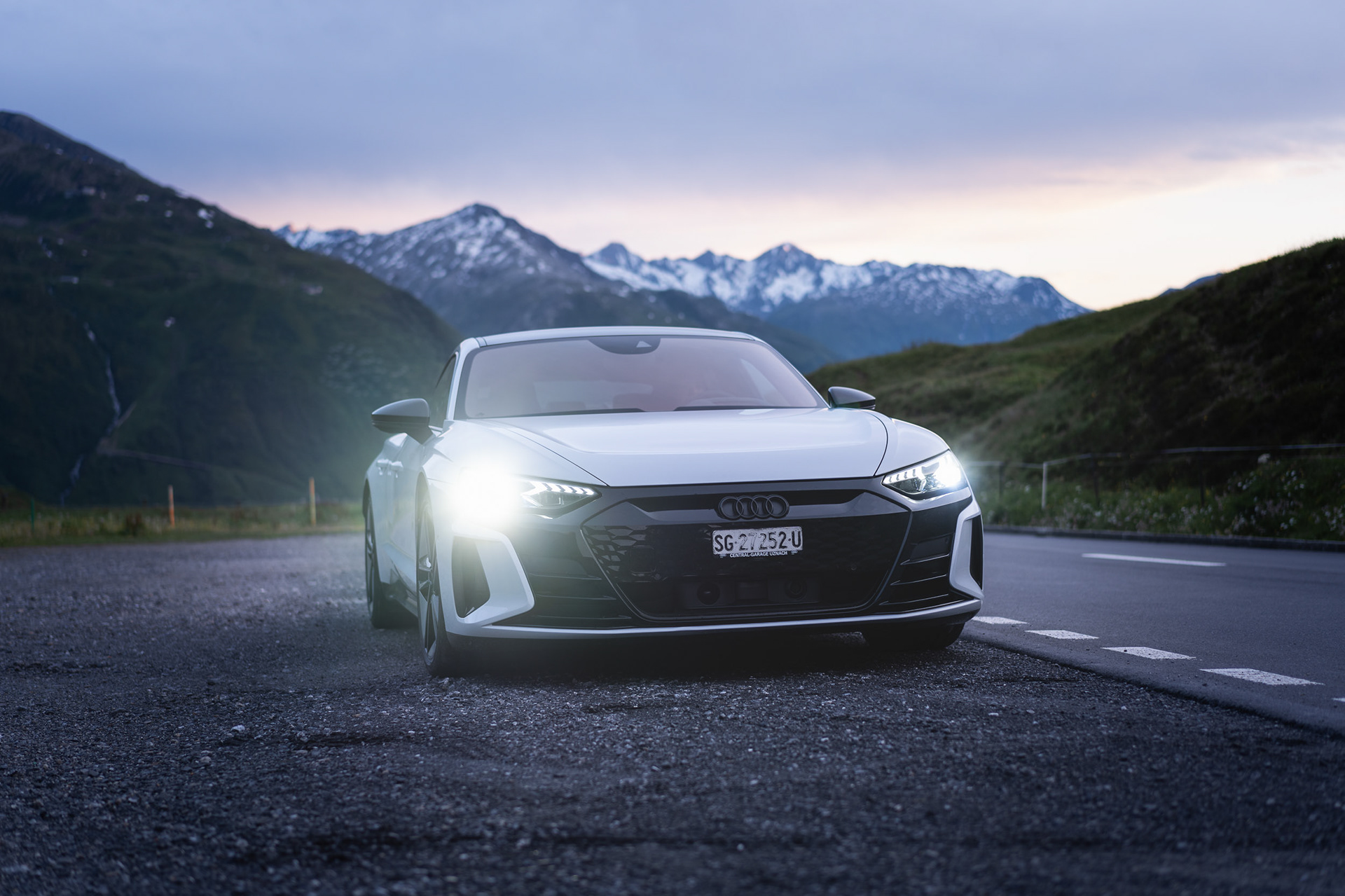 Parked front view with lights and mountain backdrop