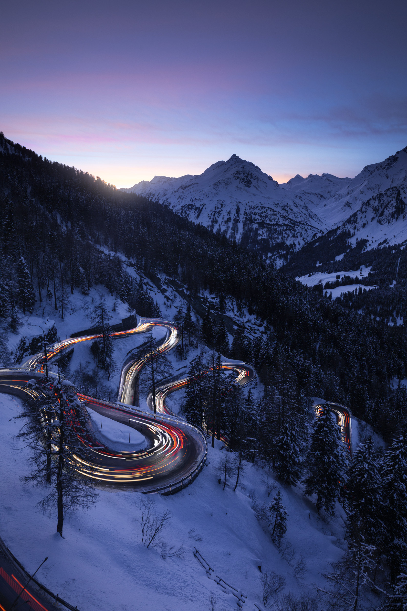 Maloja Pass Winding Mountain Road – Sunset Light Trails in the Swiss Alps