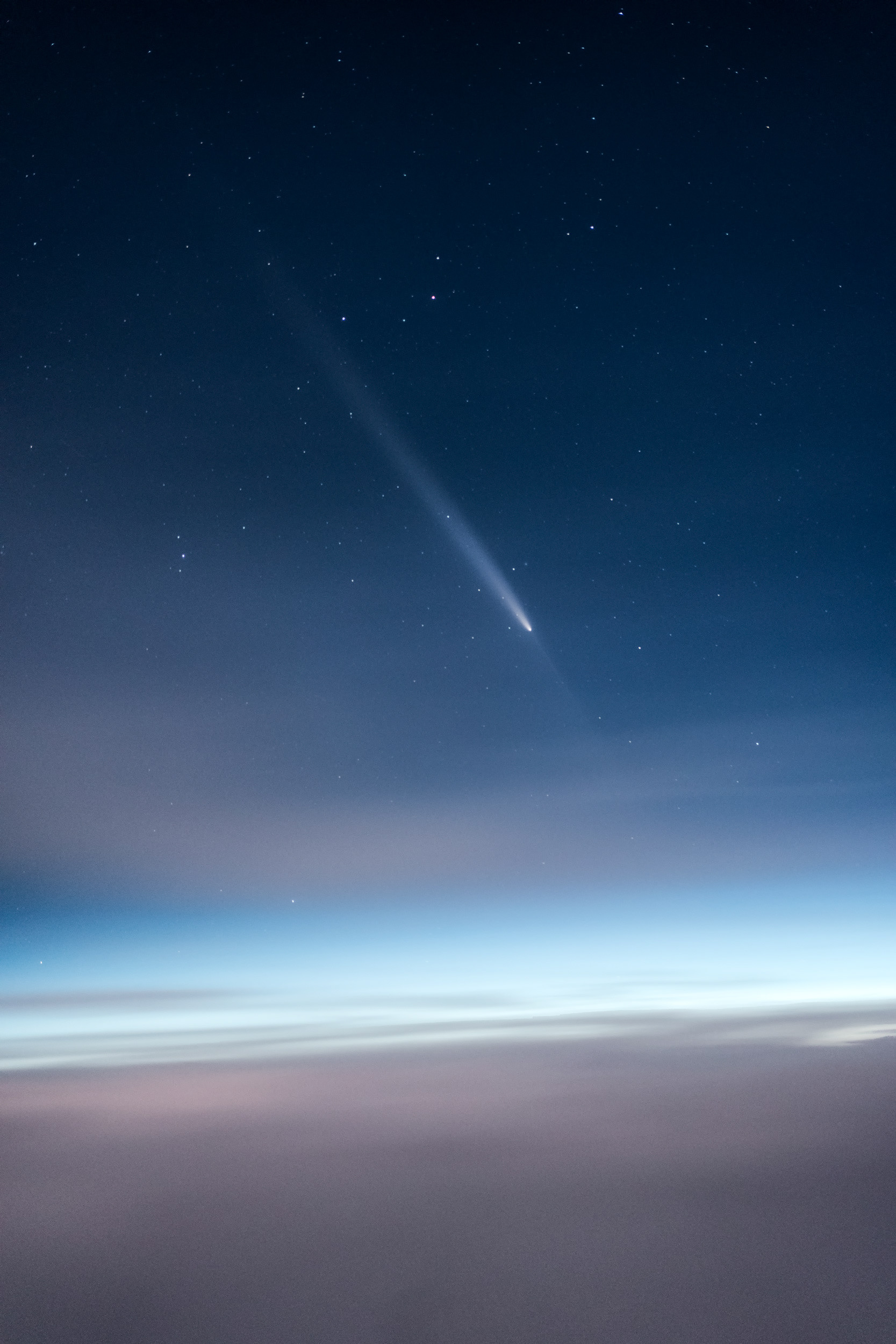 Comet Trail Above Earth’s Horizon