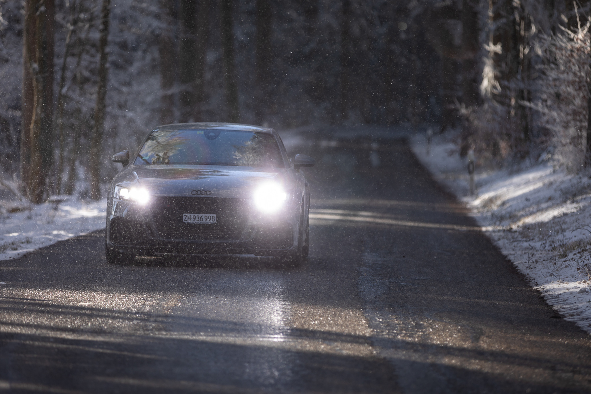 Audi TT RS with Headlights Driving on Winter Forest Road