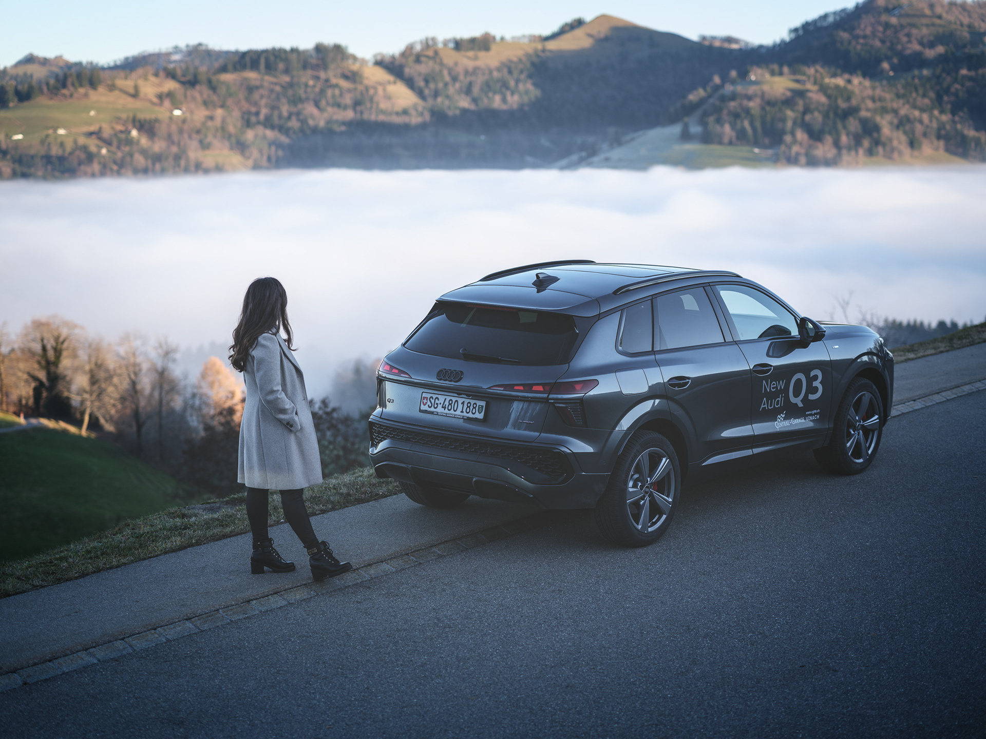 Audi Q3 Lifestyle Wide Shot – SUV and Woman in Scenic Landscape