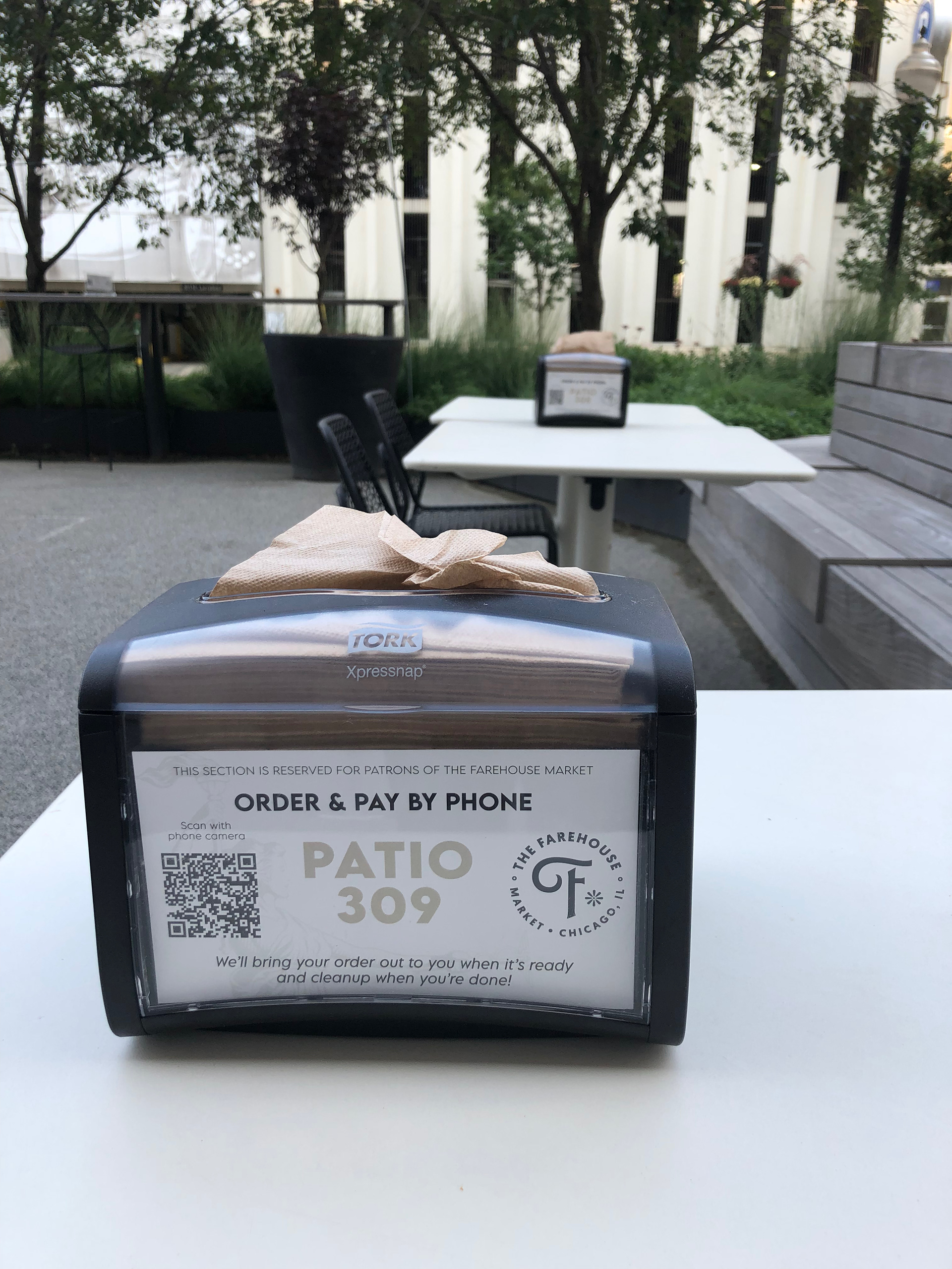 Exterior table napkin holders with instructions for placing orders