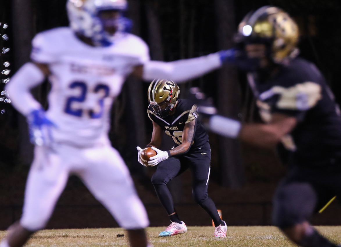Williams High School returns the ball to Eastern Guilford.