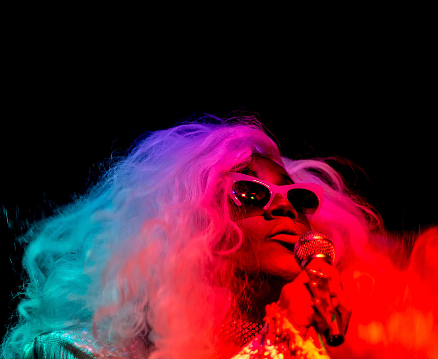 Elon alumna Stormie Daie lip syncs and dances during Dragstavaganza, Elon's annual drag performance during Spectrum's Pride Week.