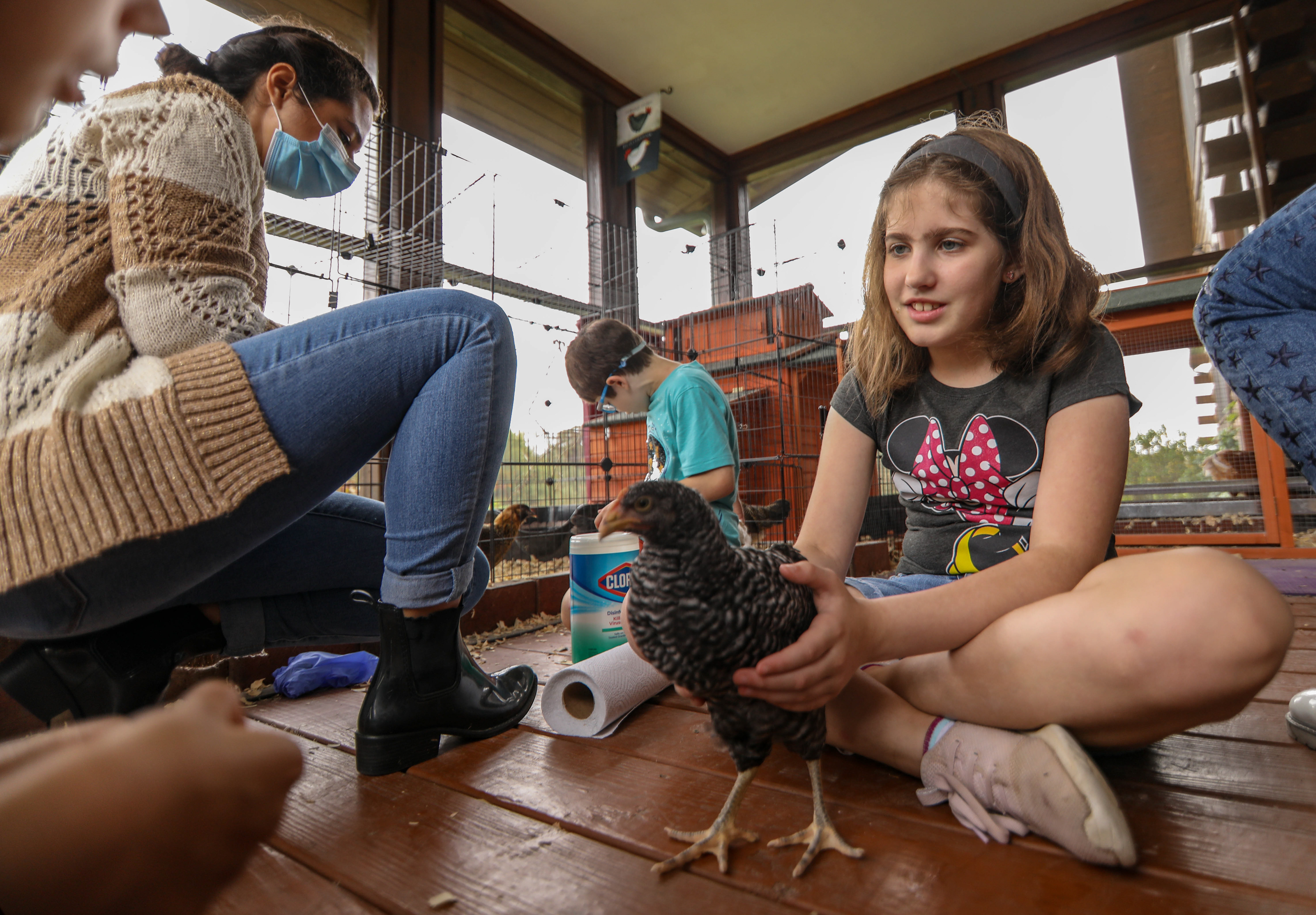 At 3 Bluebirds Farm, a nonprofit for students with Autism Spectrum Disorder, students get to play with animals as a part of their experience at the farm.