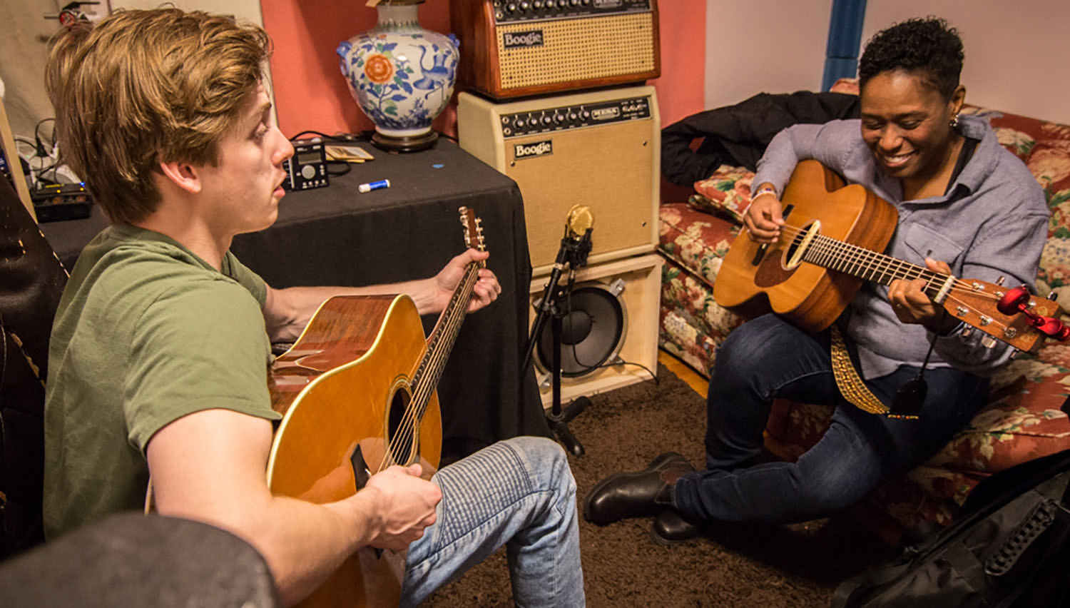 Elon Rabbi Sandra Lawson learns bluegrass from her instructor, Jay Faires.