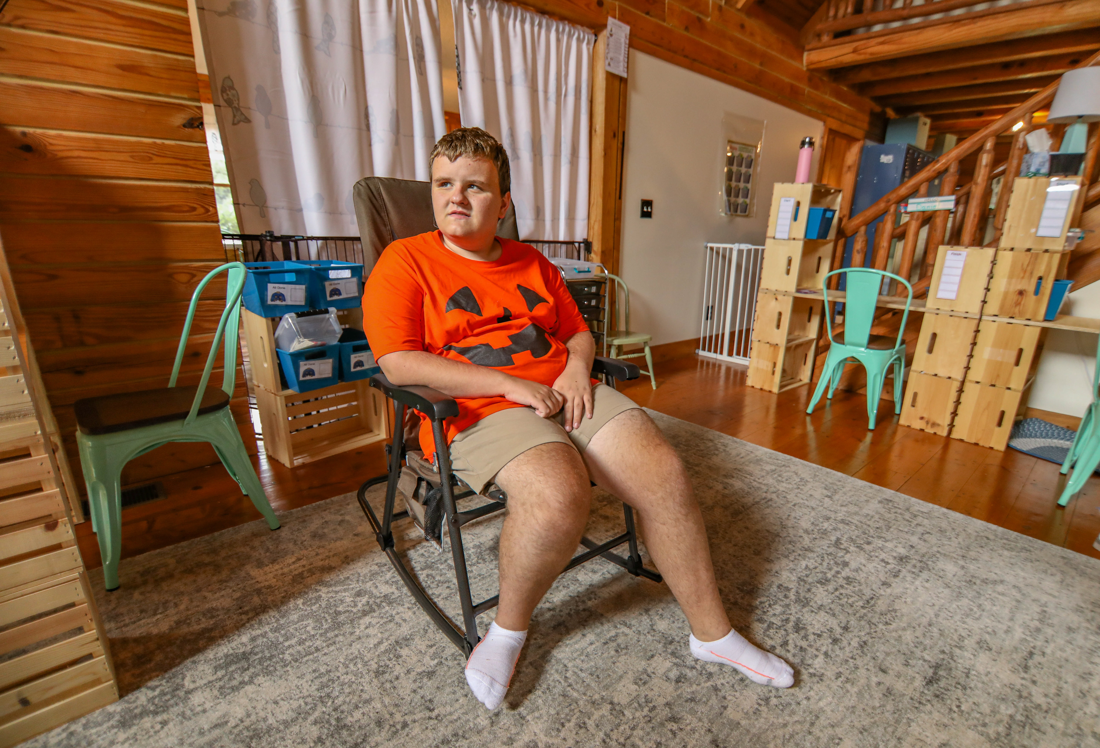 Cameron sits inside of the new facilities of the farm.