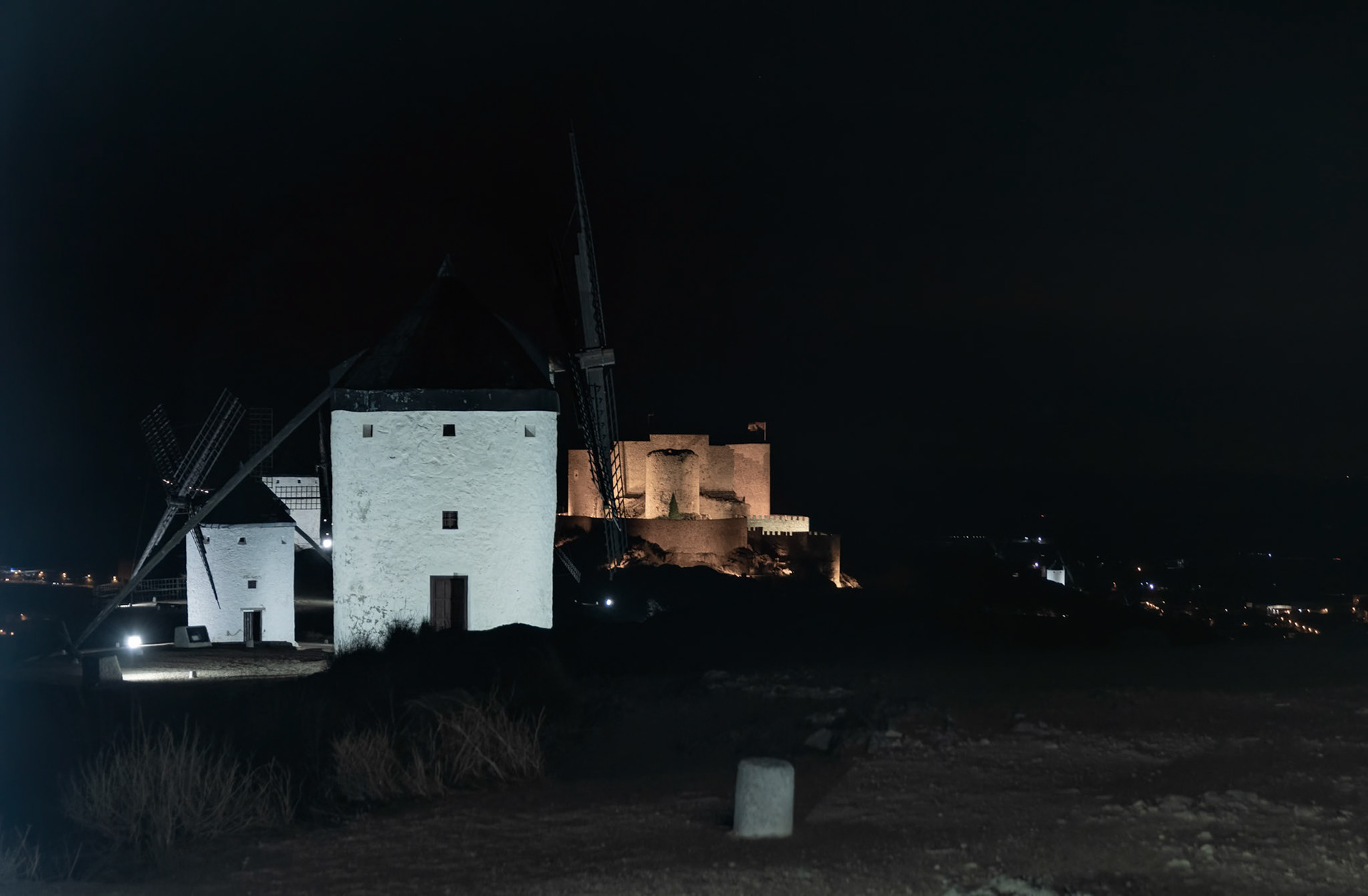 Medieval Charm: Ancient Windmills in Consuegra, Illuminated at Night
