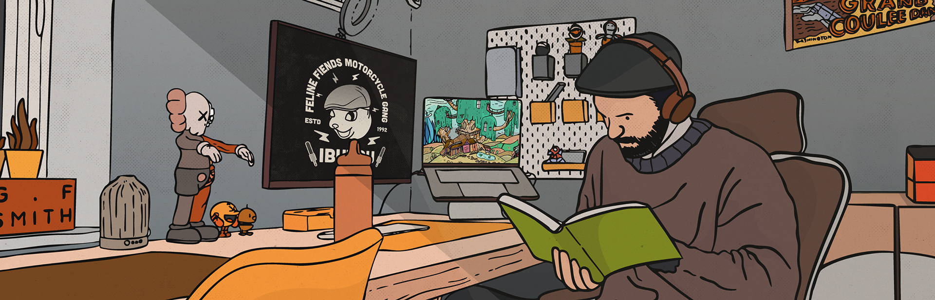 A banner image featuring an illustration of the artist busy at work in his home studio, creating illustrations in his work space