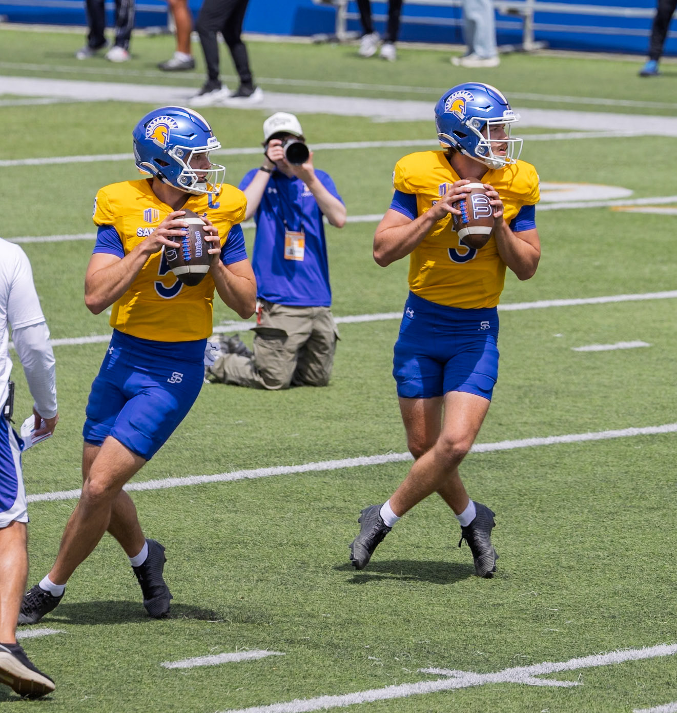 Luke Weaver (3) and Daniel Rolovich (5) drop back to pass