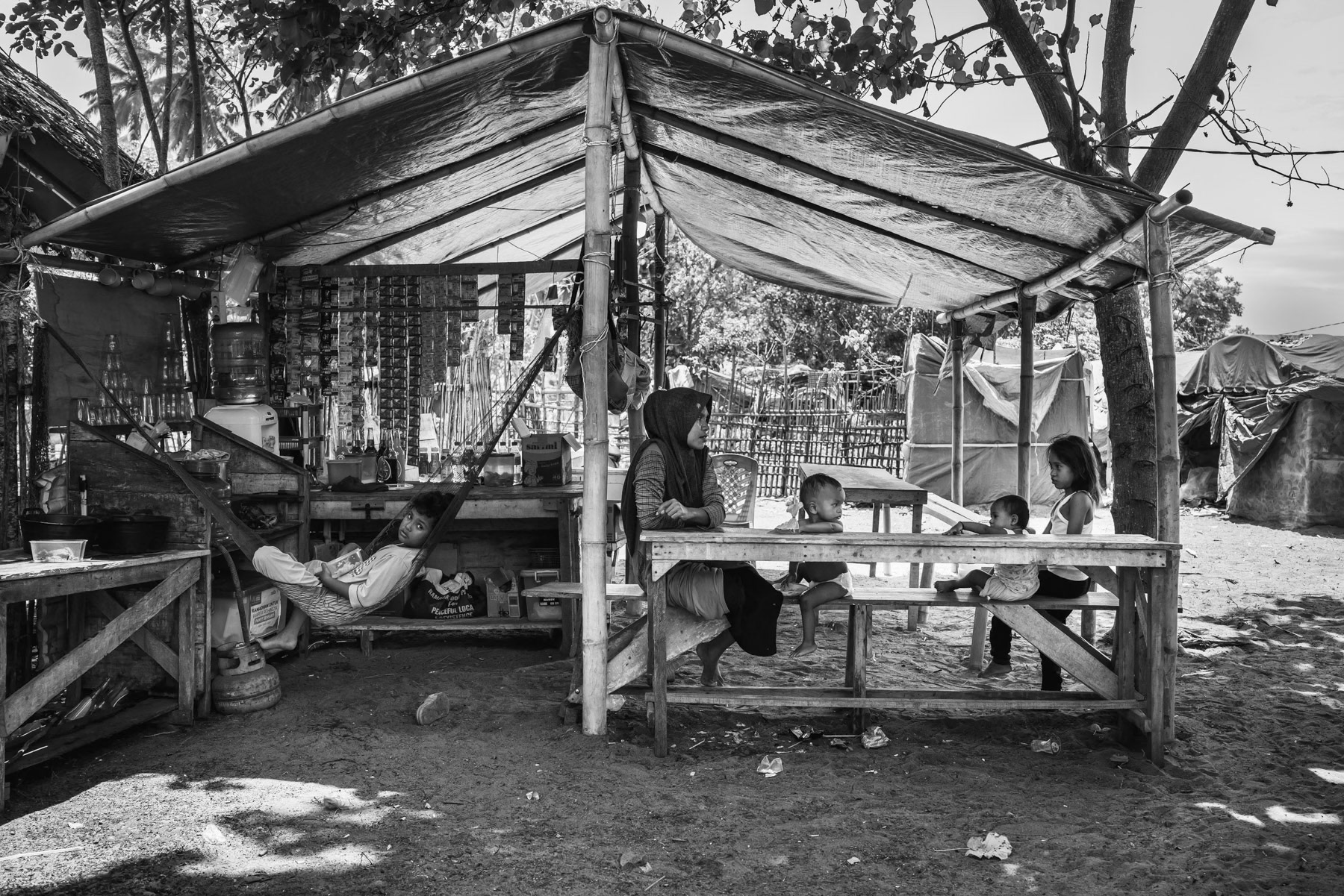 Rohingya refugees from Myanmar on the coast of Aceh where they landed after having fled by boat from Myanmar. The Rohingya have been persecuted for many years in their homeland making them flee for safety and survival to Bangladesh, Malaysia and now Indonesia as boat people spending several weeks at sea on unworthy boats at the peril of their lives. Pidie shore, temporary shelter, Aceh, Indonesia, May 2024