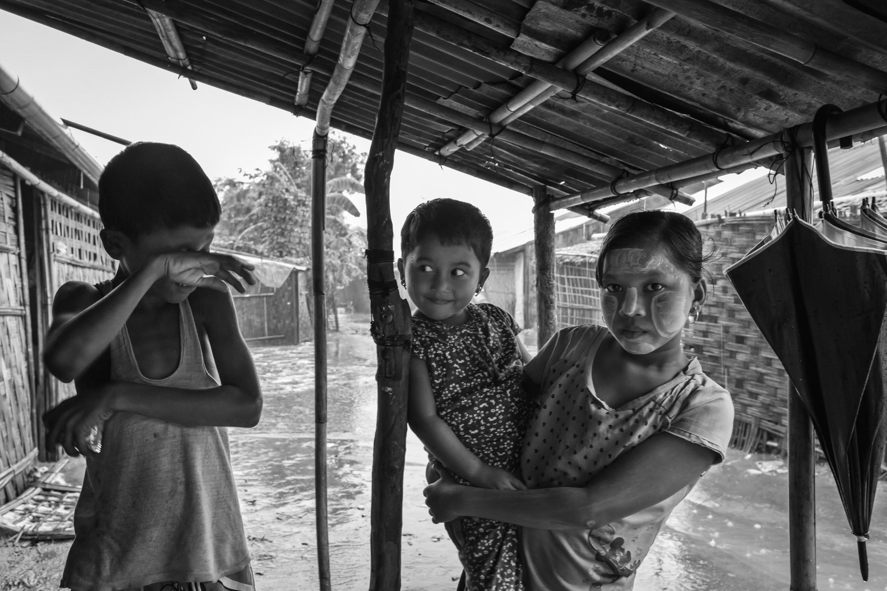 Waiting for the rain to pass, Baw Du Pha IDP camp for foribly displaced Rohingya, Sittwe township, Myanmar, October 2016