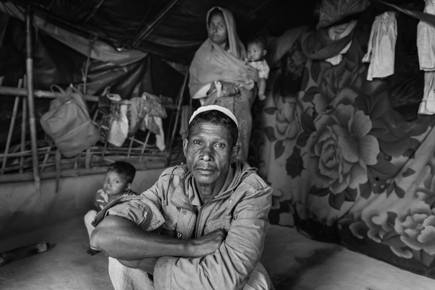 Noor Boshor, 50 years from Garotobil near Maungdaw. Was hit by a shrapnel in the arm when their village was attacked. Made it safely tto Bangladesh with his wife and eight children. Balukhali refugee camp, Ukhiya, Bangladesh, March 2018