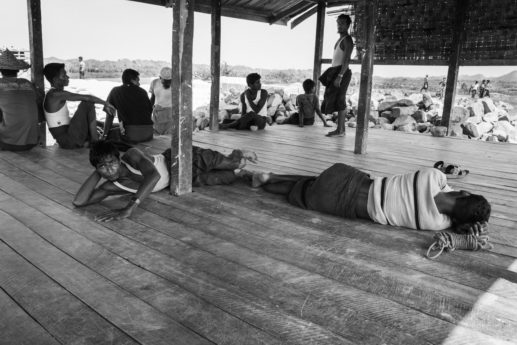 Rohingya workforce taking a rest after unloading supply boats. Kyin Ni Pyin camp for displaced persons is only accessible by boat. Paktauw township, Myanmar, May 2017