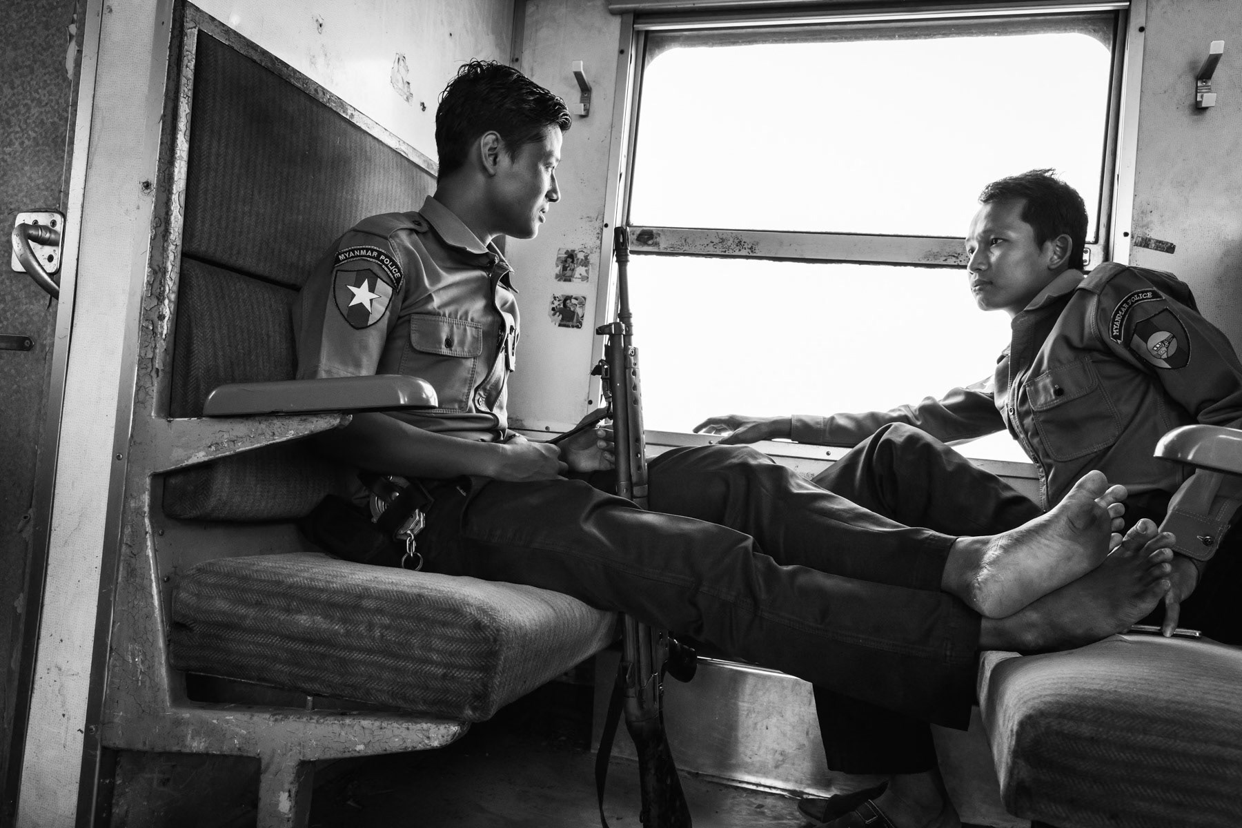 Myanmar heavily armed railway police on a train passing through the Rohingya IDP camps in Sittwe township, Myanmar, May 2017