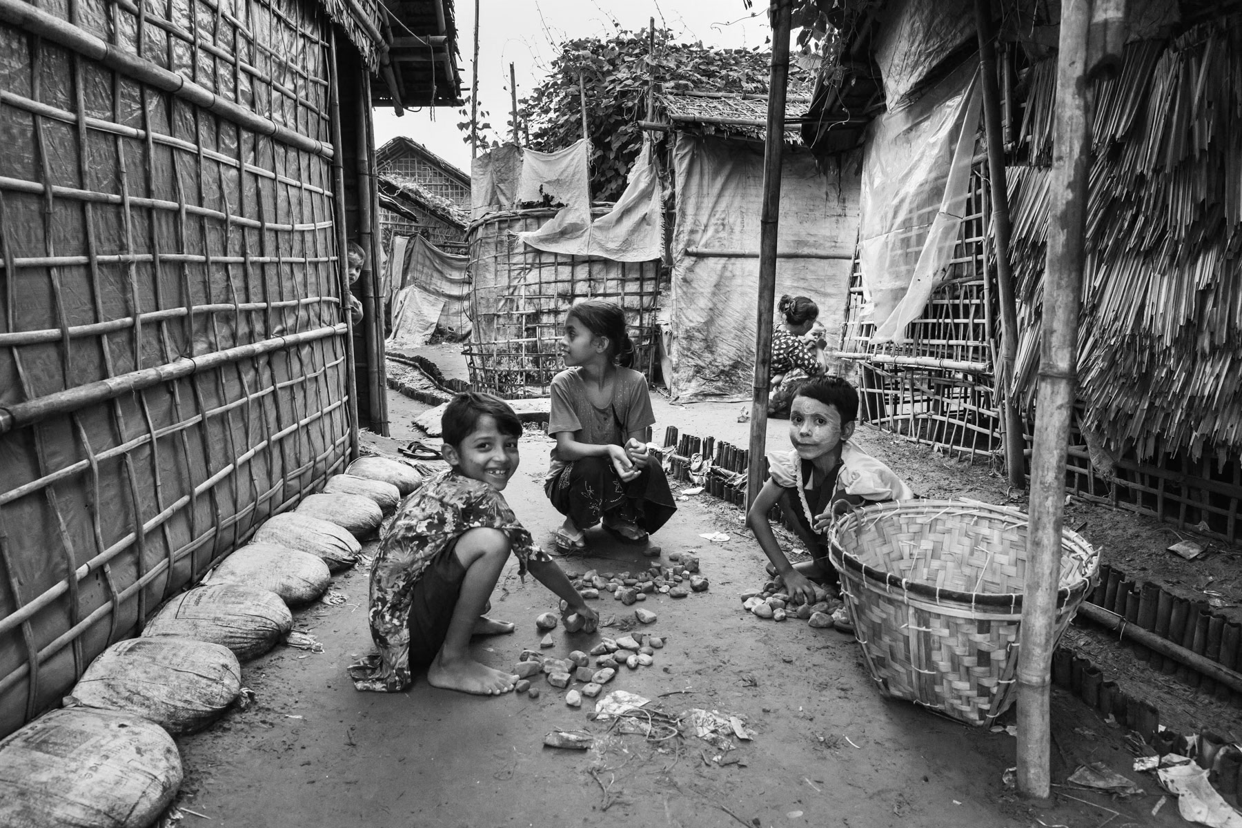 Children sorting stones, Thau Chaung internment camp for forcibly displaced Rohingya. Sittwe township, Myanmar, October 2016