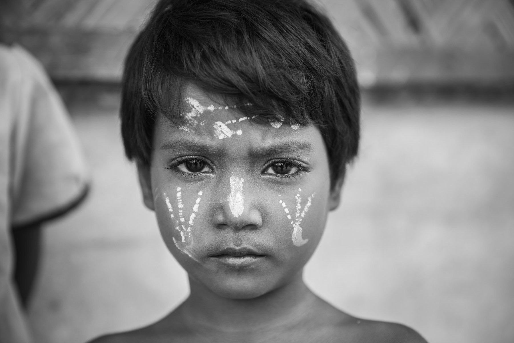 A young Rohingya refugee with traditional tanakha protecting the skin. Kutupalong refugee camp in Bangladesh, November 2017