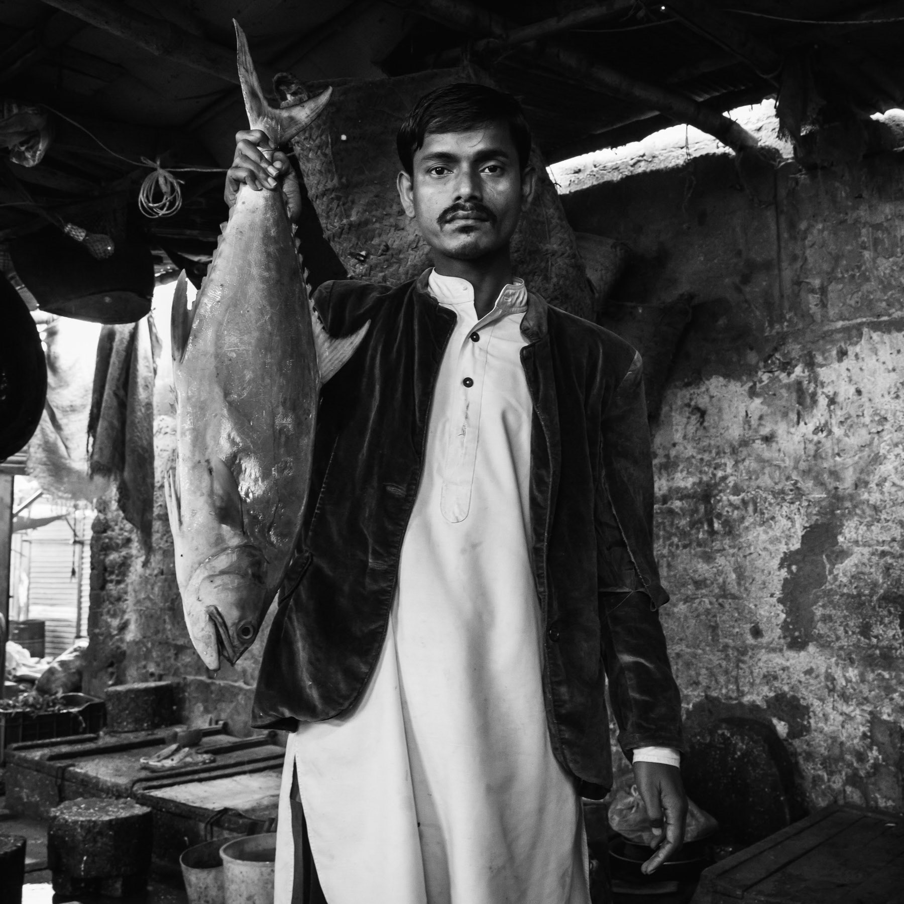 A lot of the 300,000 strong Rohingya community of Pakistan is involved in fisheries like their ancestors in Burma. Burma Colony fish market, Karachi, Pakistan, December 2016