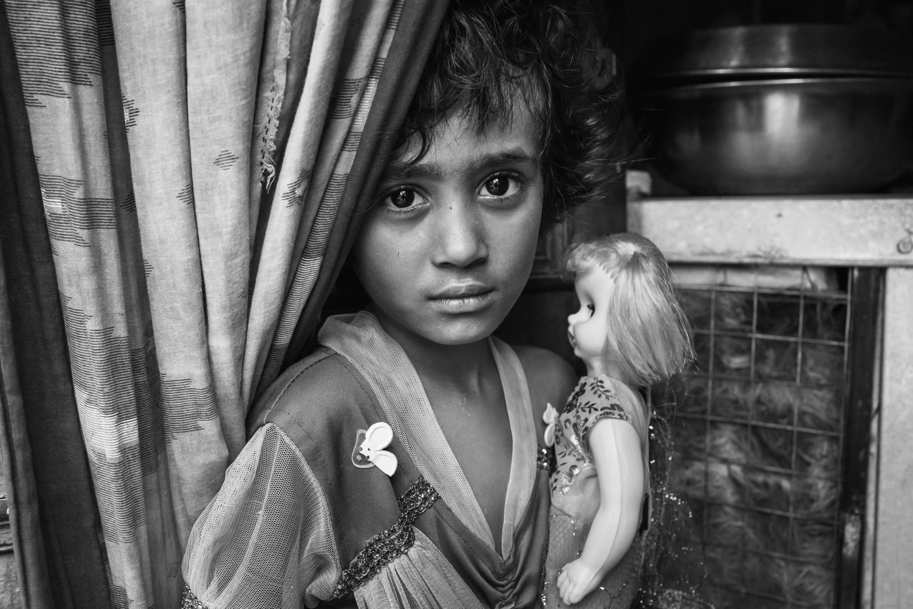 Rohingya girl and her doll, Shriram Colony in Kajuri, New Delhi, June 2016