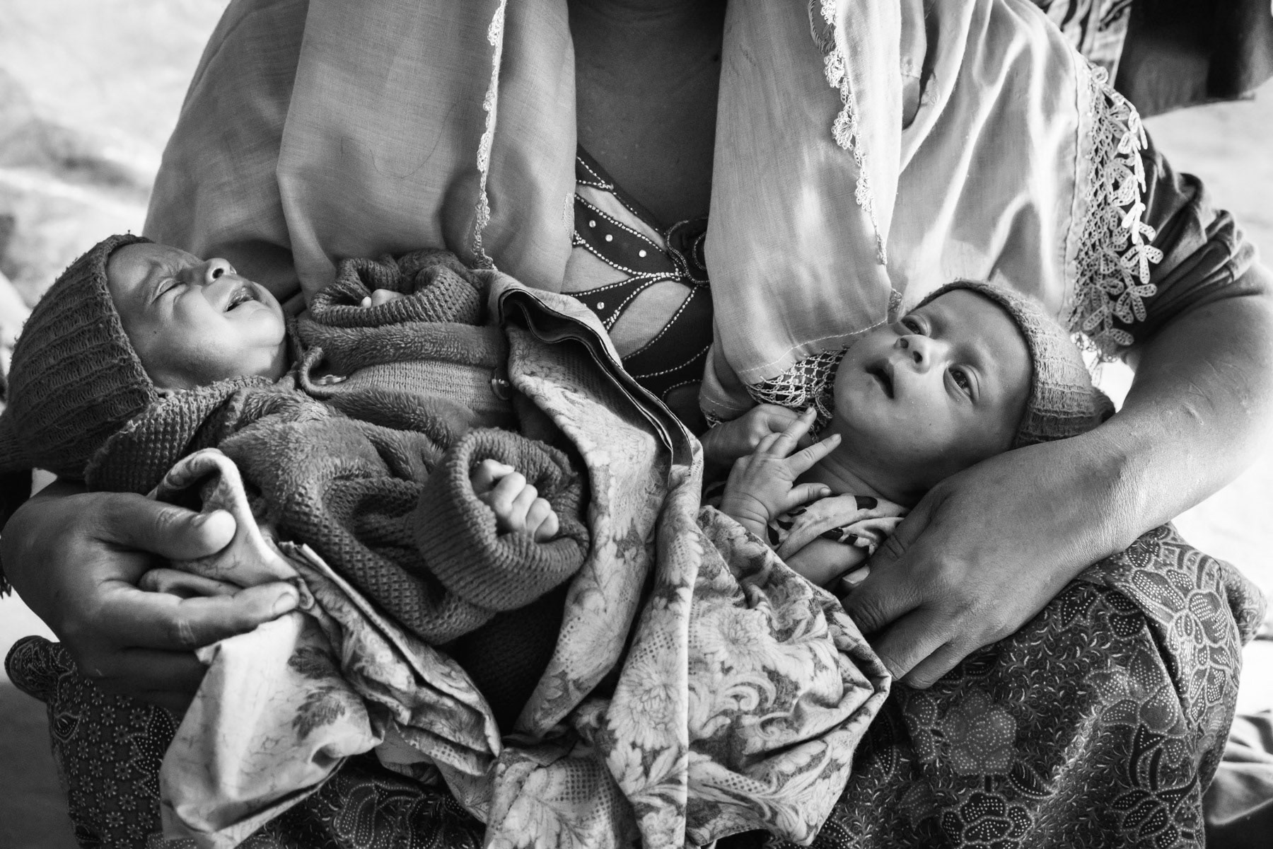 A Rohingya woman that gave birth to twins while escapting from Myanmar through the jungle. Her husband has been killed during the military security operations ongoing since October in northern Rakhine near the border with Bangladesh. Human rights groups have classified the security sweeps as ethnic cleansing campaigns. Balukhali camp for newly arrived refugees, Bangladesh, February 2017