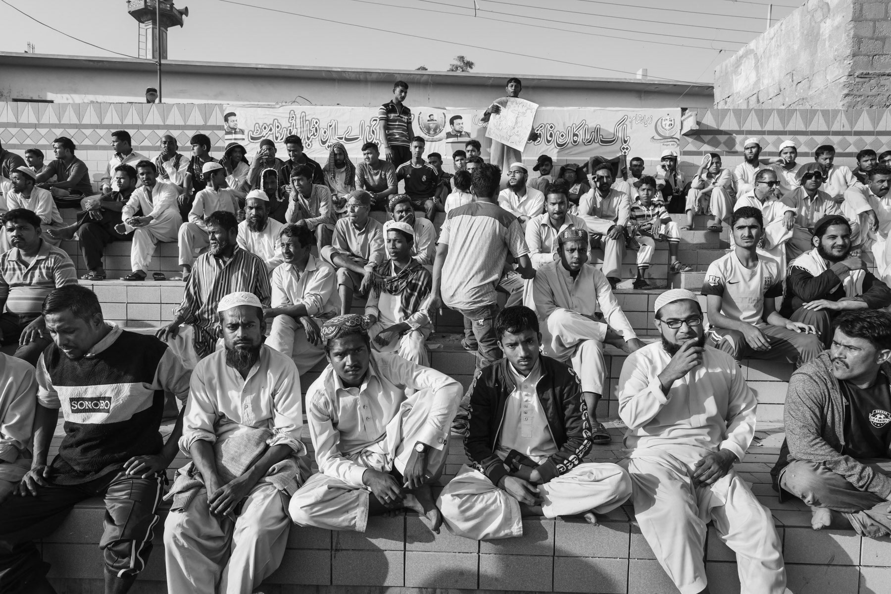 The mainly Rohingya population of Burma Colony attending the last football match of the season of the local team. Burma Colony stadium, Karachi, Pakistan, December 2016