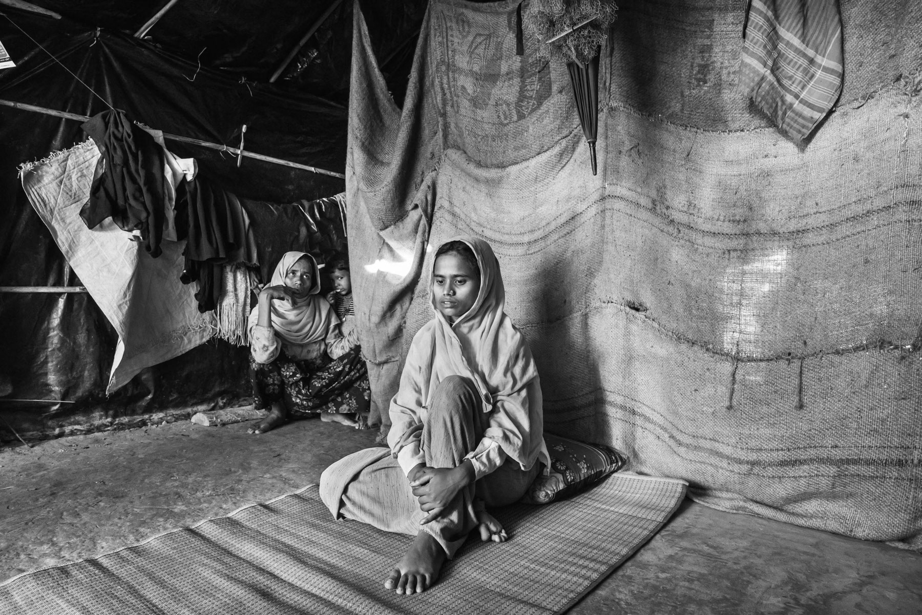 Jomila Begum is 18 years old from Tula Tuli in Maungdaw township. The attack on the village took place on 30 August, she arrived with her family 4 days later in Bangladesh. Her husband and 2 year old son got shot by the Myanmar military. While running away she was shot near the belly. Kutupalong refugee camp, Cox's Bazar, Bangladesh, November 2017