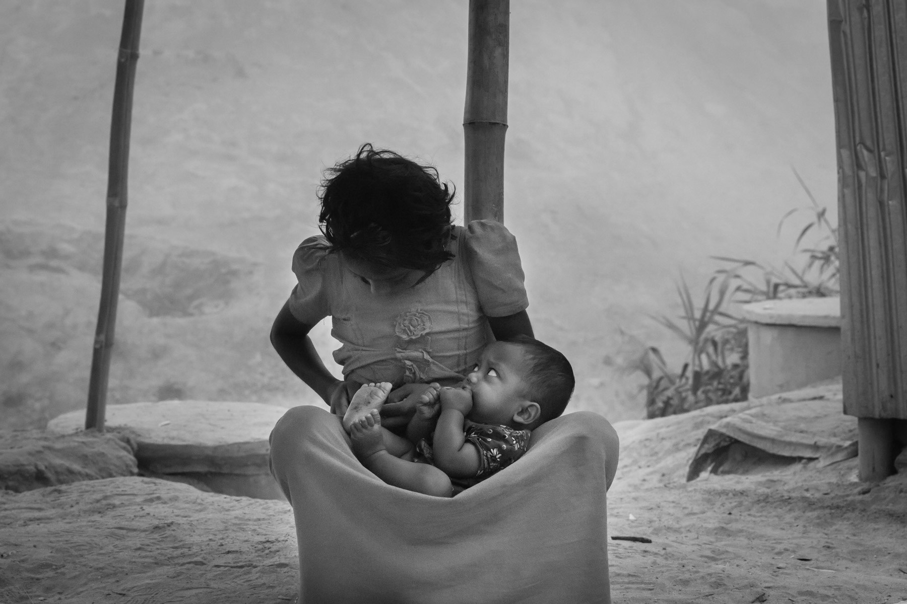 A Rohingya girl with her little brother that recently arrived from Myanmar. Rohingya have fled Myanmar since August and the start of the latest military security operations that are now widely qualified as ethnic cleansing campaigns. Balukhali camp, Ukhiya, Bangladesh, March 2018