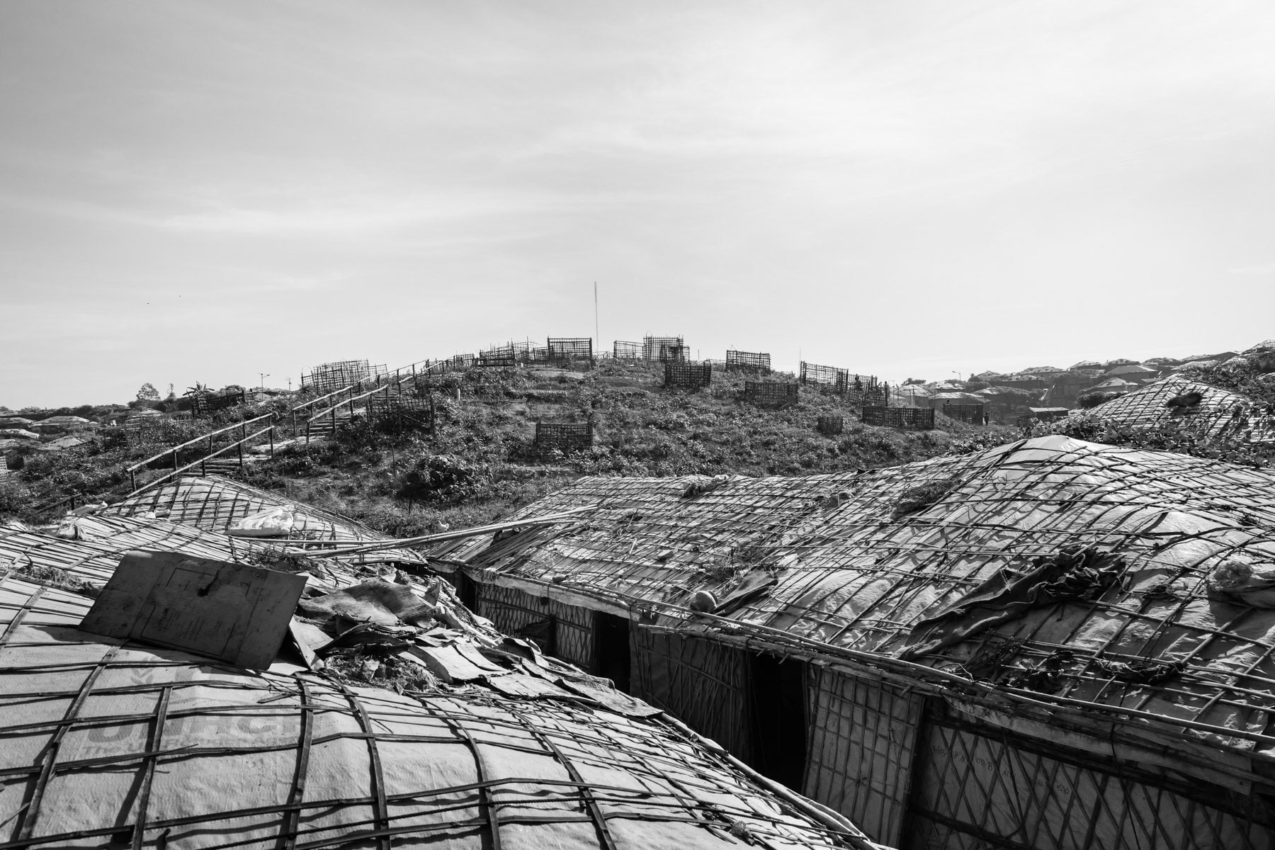 Rohingya graveyard in between the accomodation blocks sheltering the more than 650,000 refugees that have fled Myanmar since August 2017. Kutupalong camp section II, Cox's Bazar, Bangladesh, October 2018