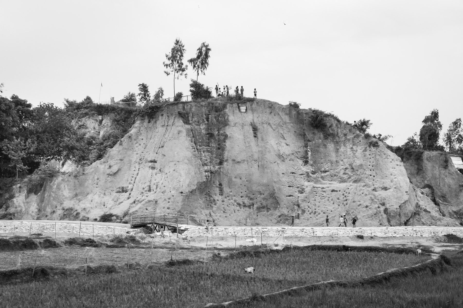 Rohingya children catching wind with their kites on top of a hill. Thangkhali refugee camp, Bangladesh, October 2018