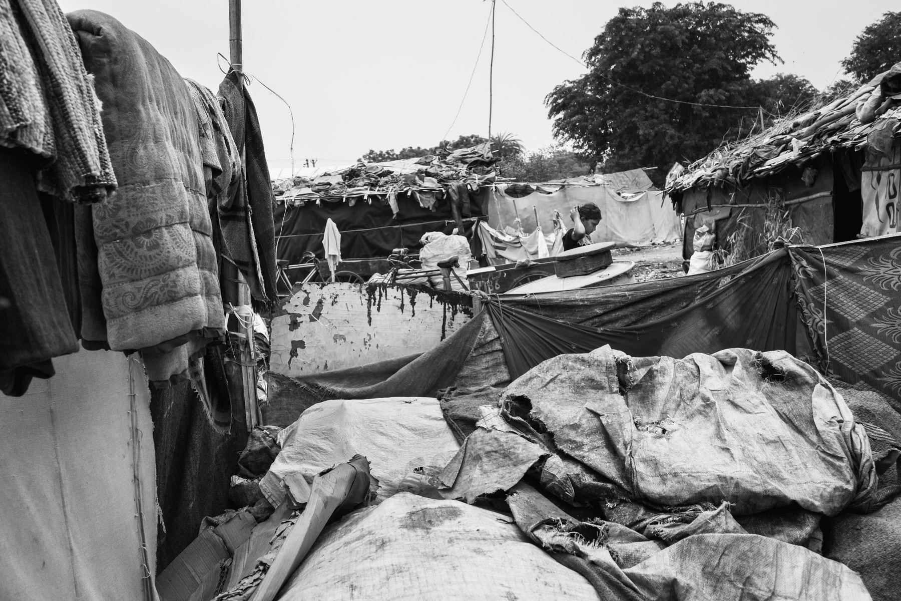 Rohingya refugee camp where the entire population of 130 is in a state of bonded labour as waste pickers. They are paid less than a dollar a day and have no means to repay their debts for being trafficked into India from Bangladesh. Burana village in Haryana State, India, June 2016