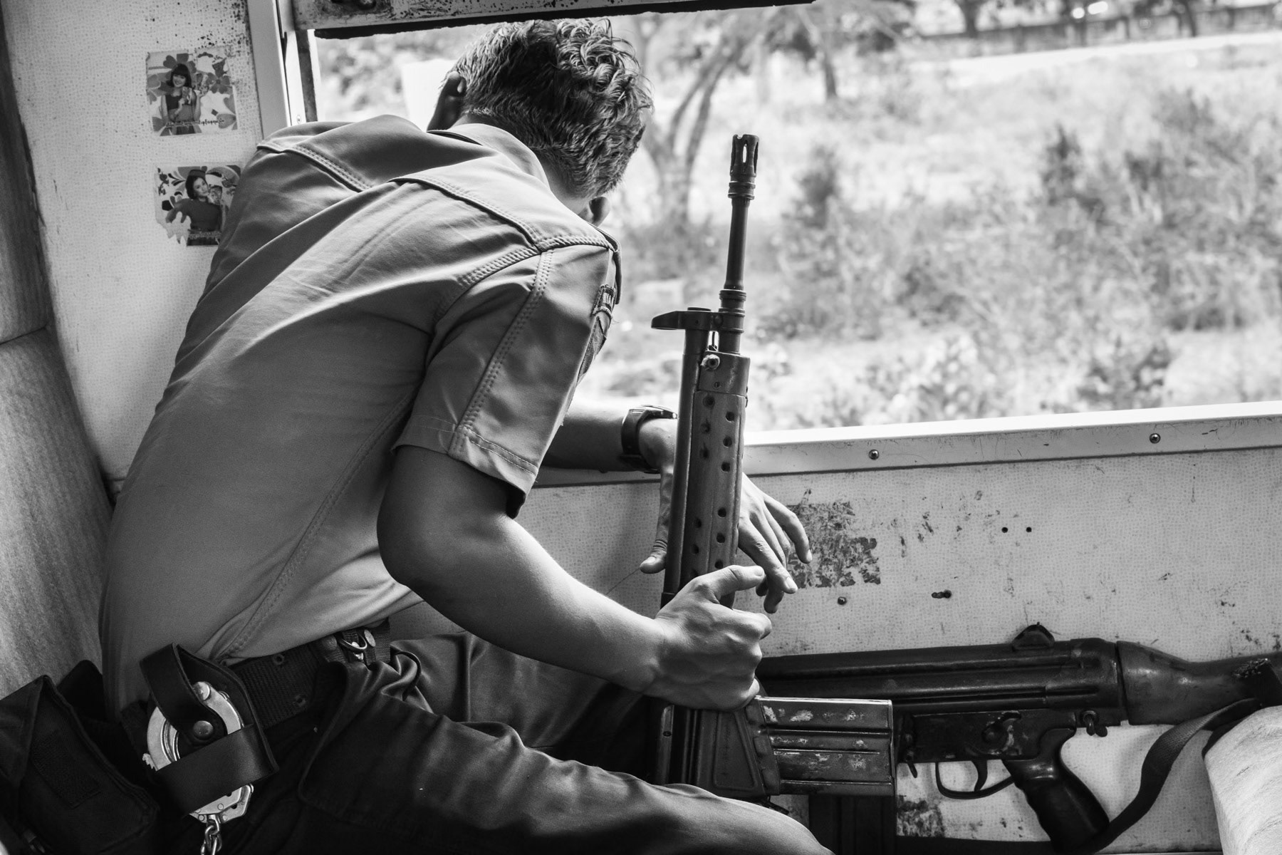 Local train that runs through the IDP camps in Sittwe township where the Rohingya population is only allowed in a segregated wagon guarded by heavily armed police. Sittwe township, Rakhine State in Myanmar, May 2017