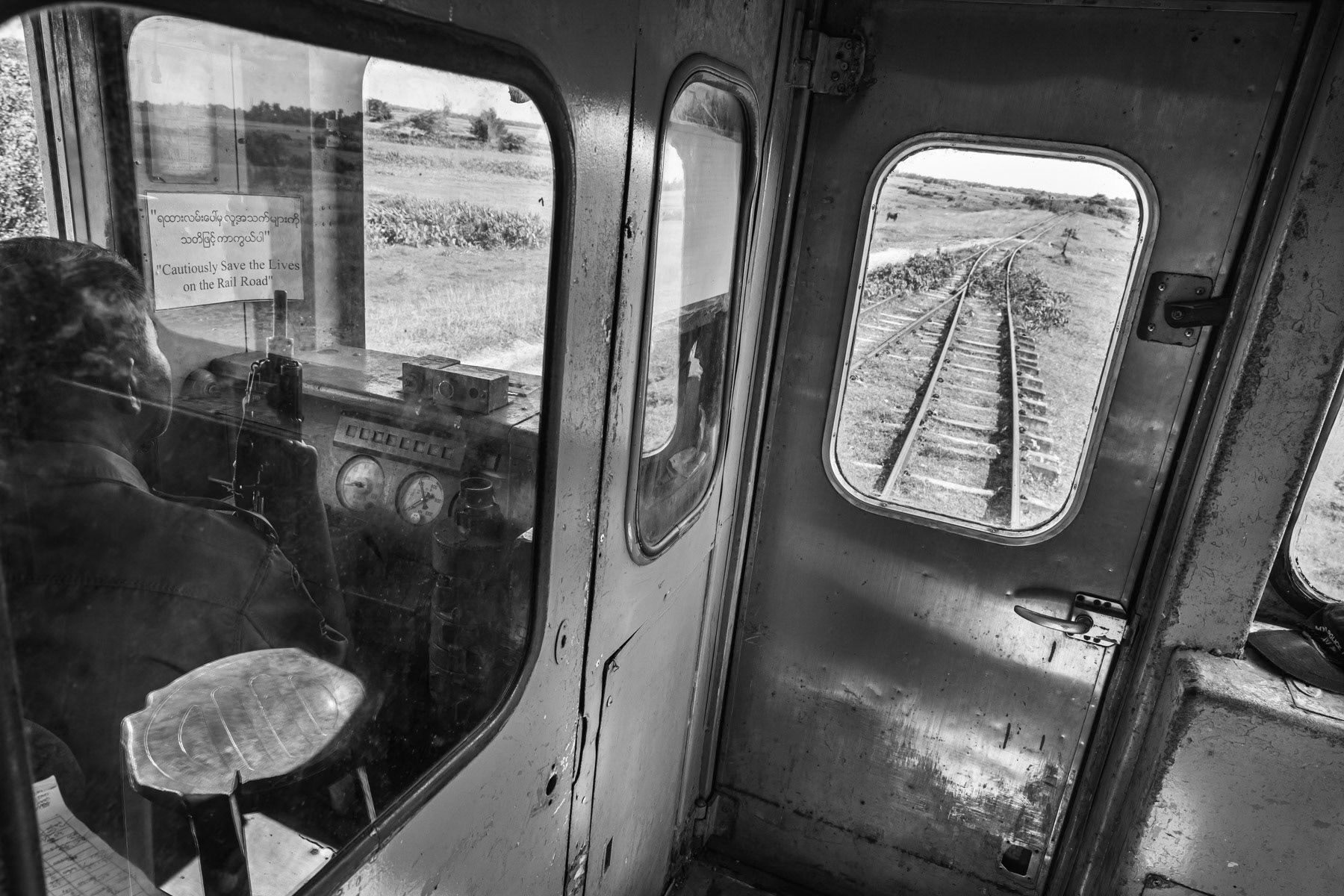 Train travelling between the Rohingya IDP camps, guarded by heavily armed police forces. Sittwe township, Myanmar, September 2019