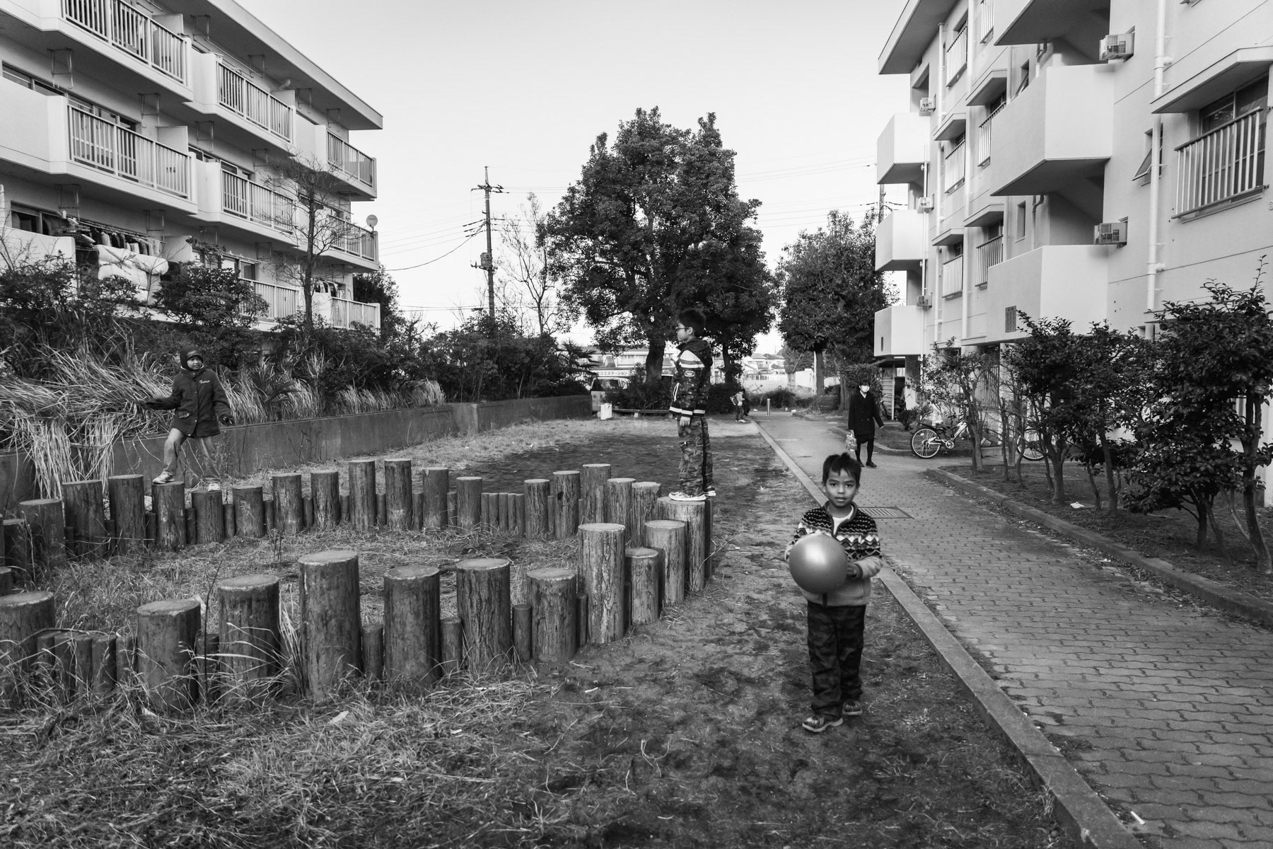 Rohingya refugees playing in front of their building, Tatebayashi, Japan, January 2017